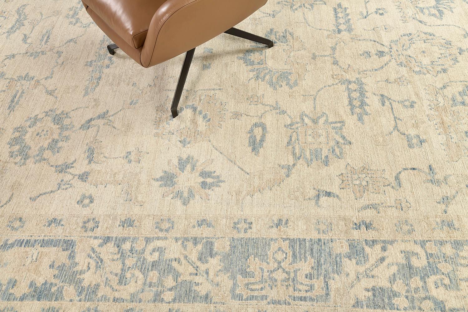 A simplicity through its beauty of a hand-spun wool revival of Oushak rug from our collections. From the sage gray of the field to the outlines of gloomy blue motifs and scrolls. It creates a soulful balance of everything from modern decor to