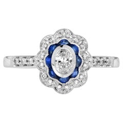 Bague de fiançailles de style vintage en or 18 carats avec halo de diamants ovales et saphirs bleus