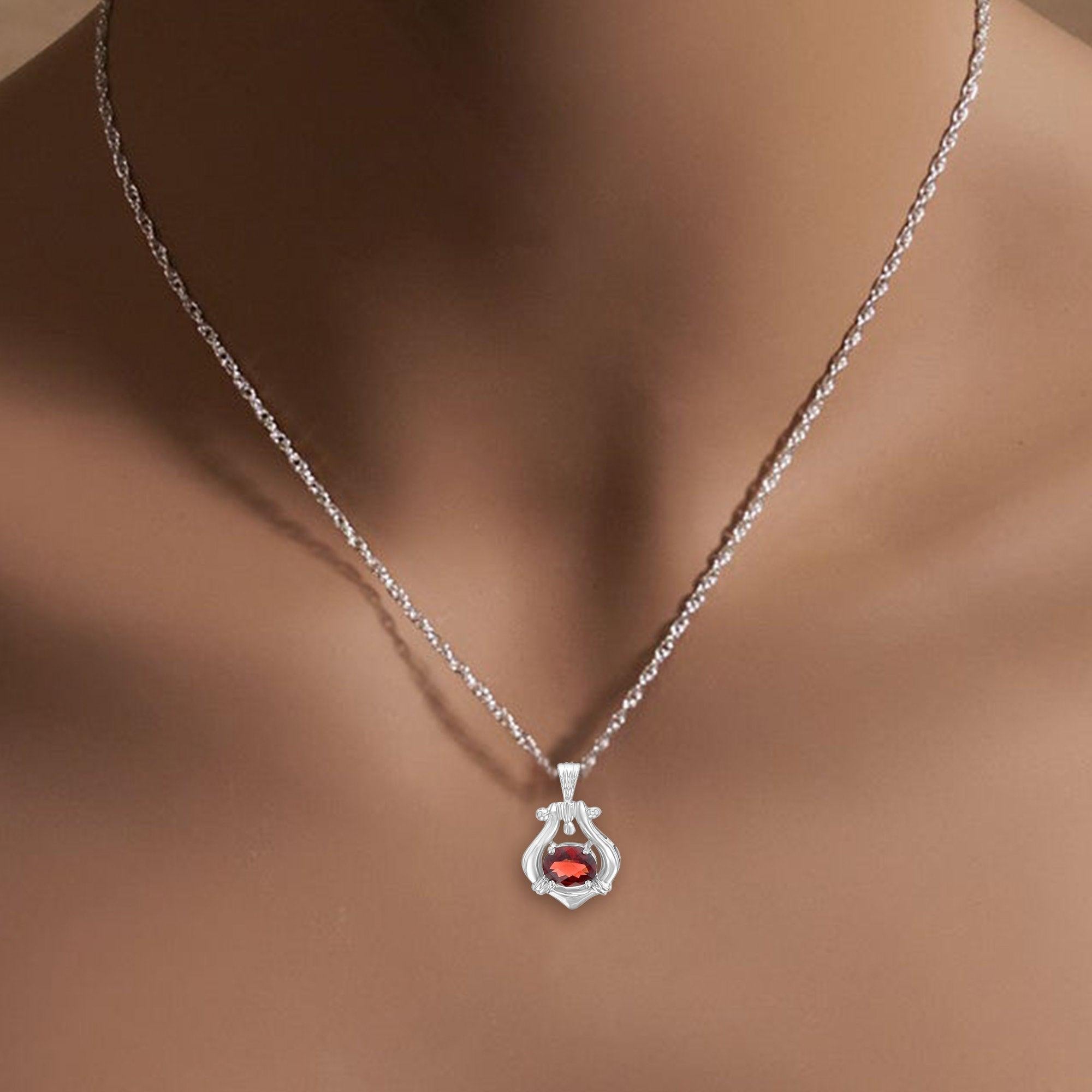 ♥ Product Summary ♥

Main Stone: Garnet 
Metal: 14k White Gold 
Size of Garnet: 9mm x 7mm  
Stone Cut: Oval
Dimensions: 18mm x 16mm
Chain: 18