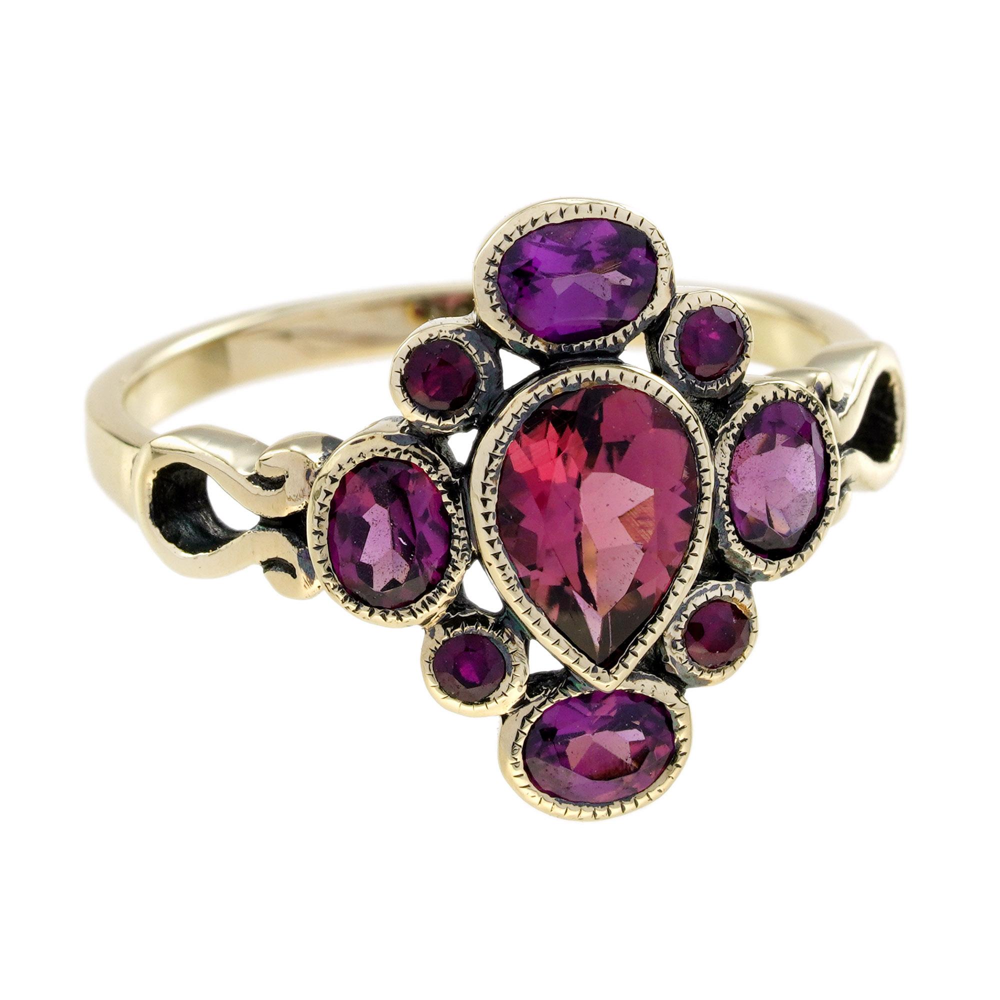 A perfect gift for a friend or family member, this red gemstones ring is fashioned in popular 9k yellow gold and features a cluster of rubies and rhodolite surrounding the center pear shaped pink tourmaline. 9K Yellow Gold.
Ring Information
Style: