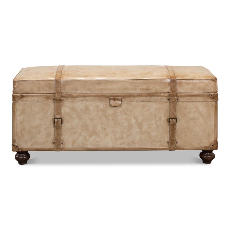 Vintage-style pearl leather trunk bench. A fully functional trunk that hinges open to reveal storage. The padded leather exterior makes it a great bench to sit on or a low table to put your feet up, too. 

This piece has lots of vintage-inspired