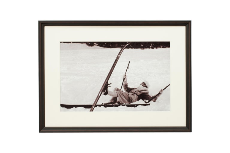 'OPPS!', a modern framed and mounted black and white photograph after an original 1930's skiing photograph. The frame is black with a burgundy undercoat, the glazing is clarity+ premium synthetic glass. Black & white alpine photos are the perfect