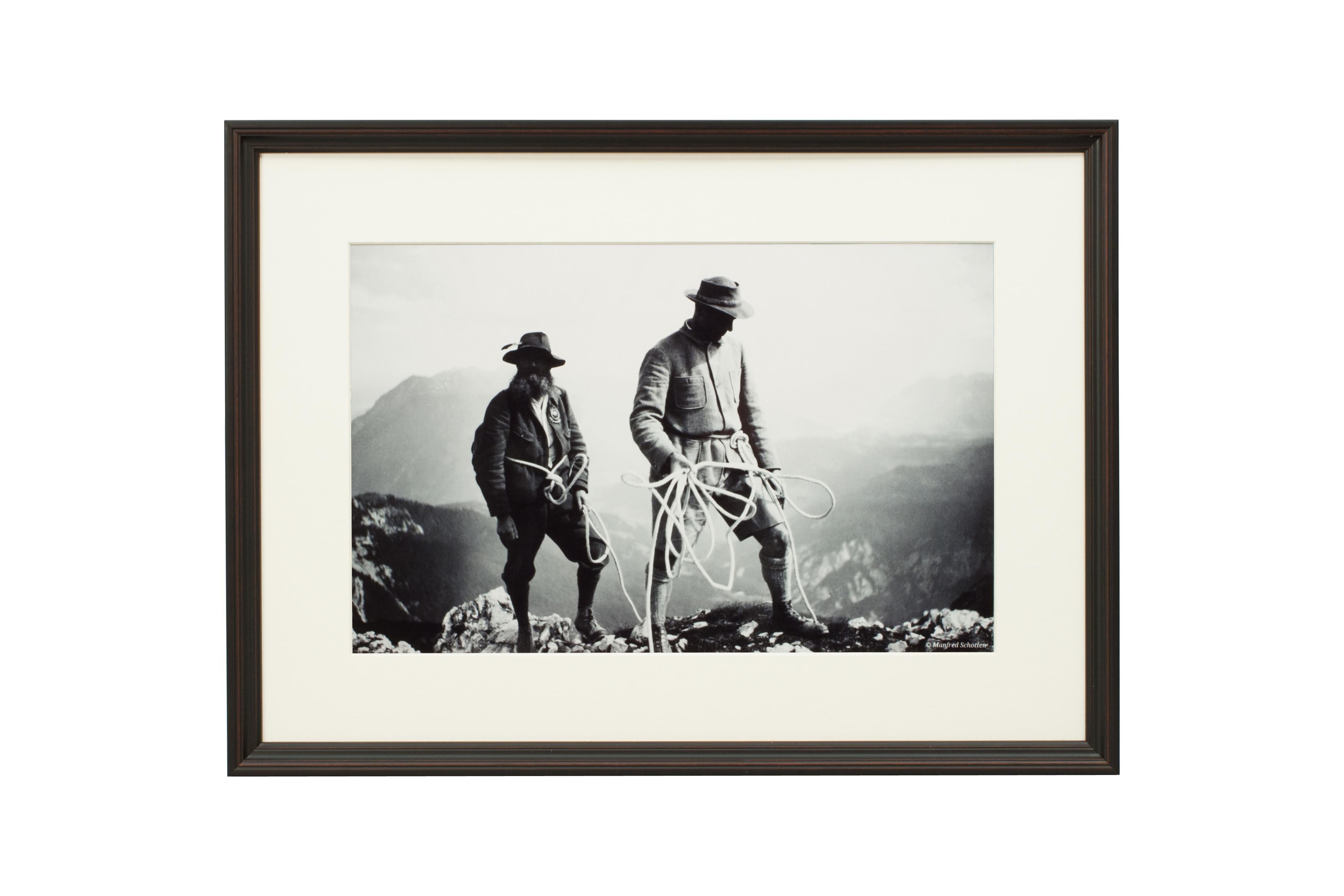 'SAFETY FIRST', a modern framed and mounted black and white photograph after an original 1930's skiing photograph. The frame is black with a burgundy undercoat, the glazing is clarity+ premium synthetic glass. Black & white alpine photos are the