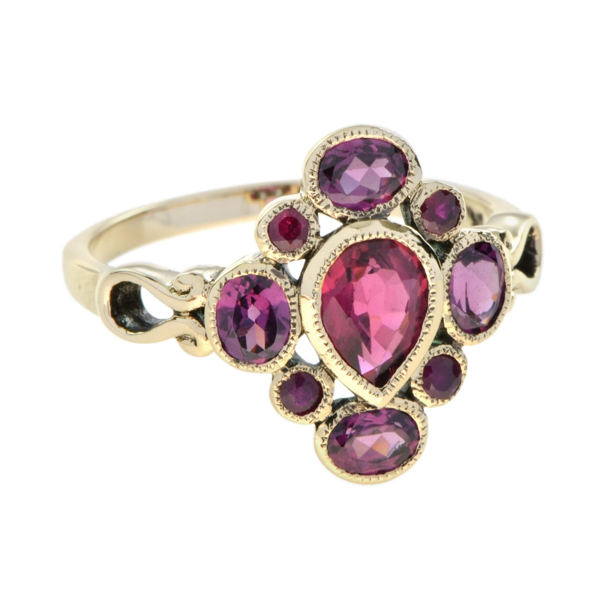 A perfect gift for a friend or family member, this red gemstones ring is fashioned in popular 9k yellow gold and features a cluster of rubies and rhodolite surrounding the center pear shaped pink tourmaline. 

Information
Style: Vintage
Metal: 9K