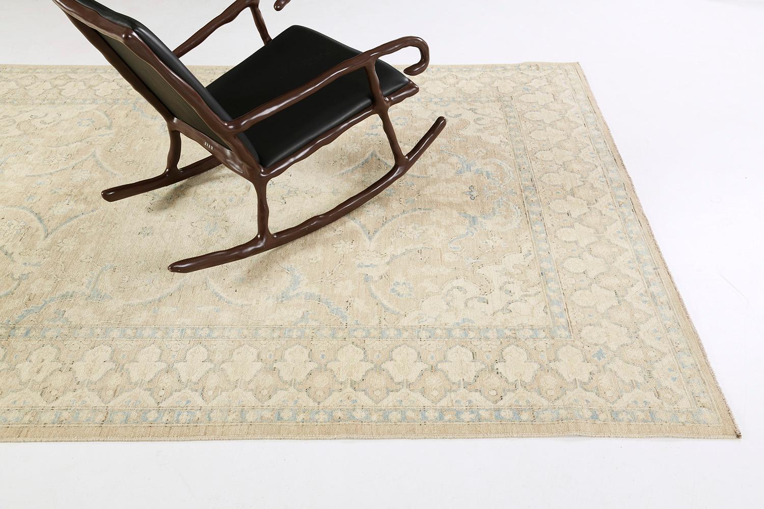 This elegant rug in Rapture collection features a majestic central rosette medallion surrounded by graceful floral forms, leafy tendrils, stylized florals and lush palmettes. Through the use of muted neutral color scheme of beige, ivory and cerulean