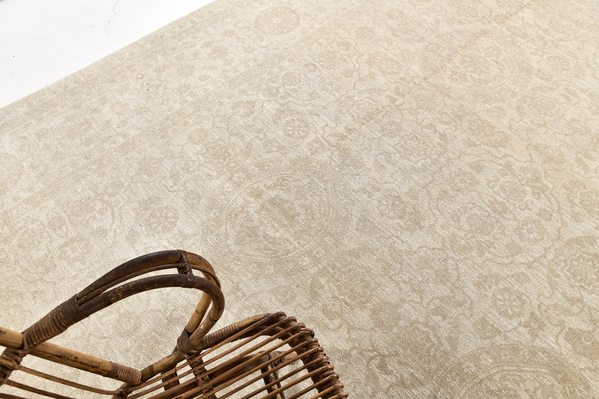 A timeless rug revival of our Rapture Collection in curvilinear motif. In the sophisticated muted tones of sand and tan features an all-over series of rosettes that are surrounded by a majestic network of vines and tendrils enclosed by a inner and