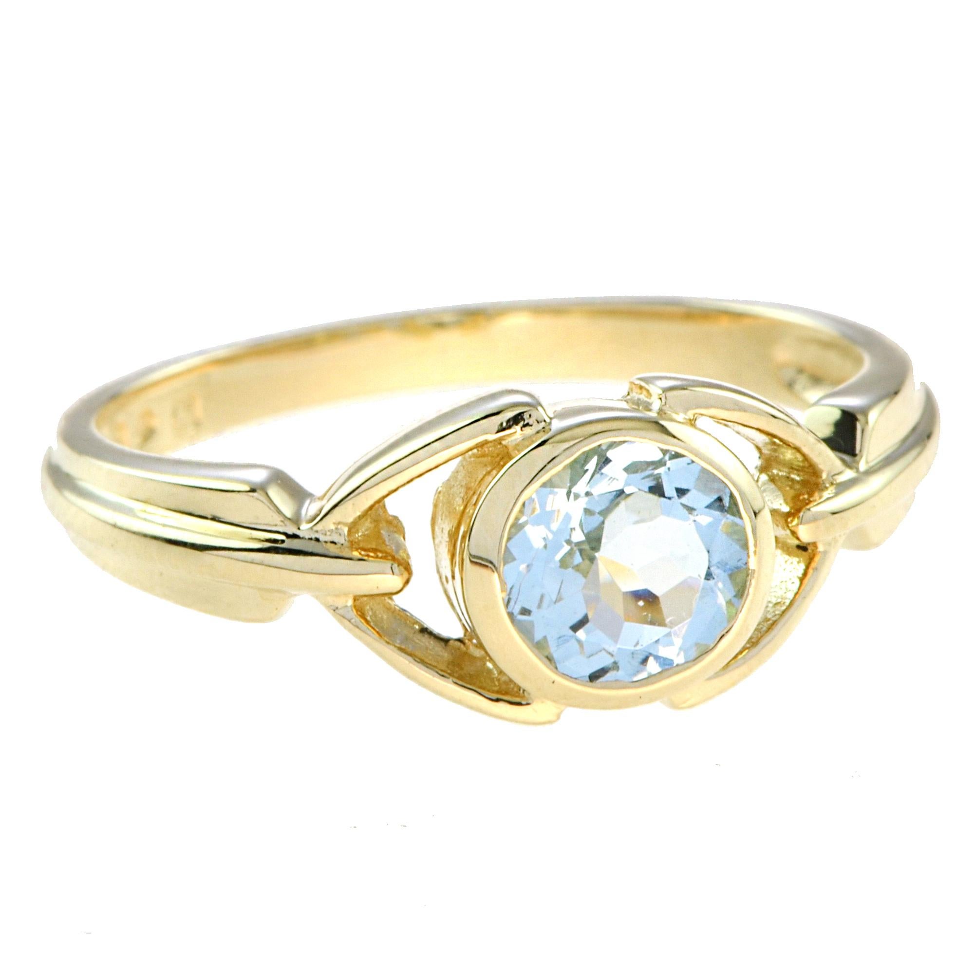 You are looking at a dainty band of classic handcraft openwork design. The Aquamarine solitaire ring is captivating in a bezel setting. A unique ring that can be worn as a fashion accessory or as a very edgy engagement ring. 14K Yellow Gold. 
Ring