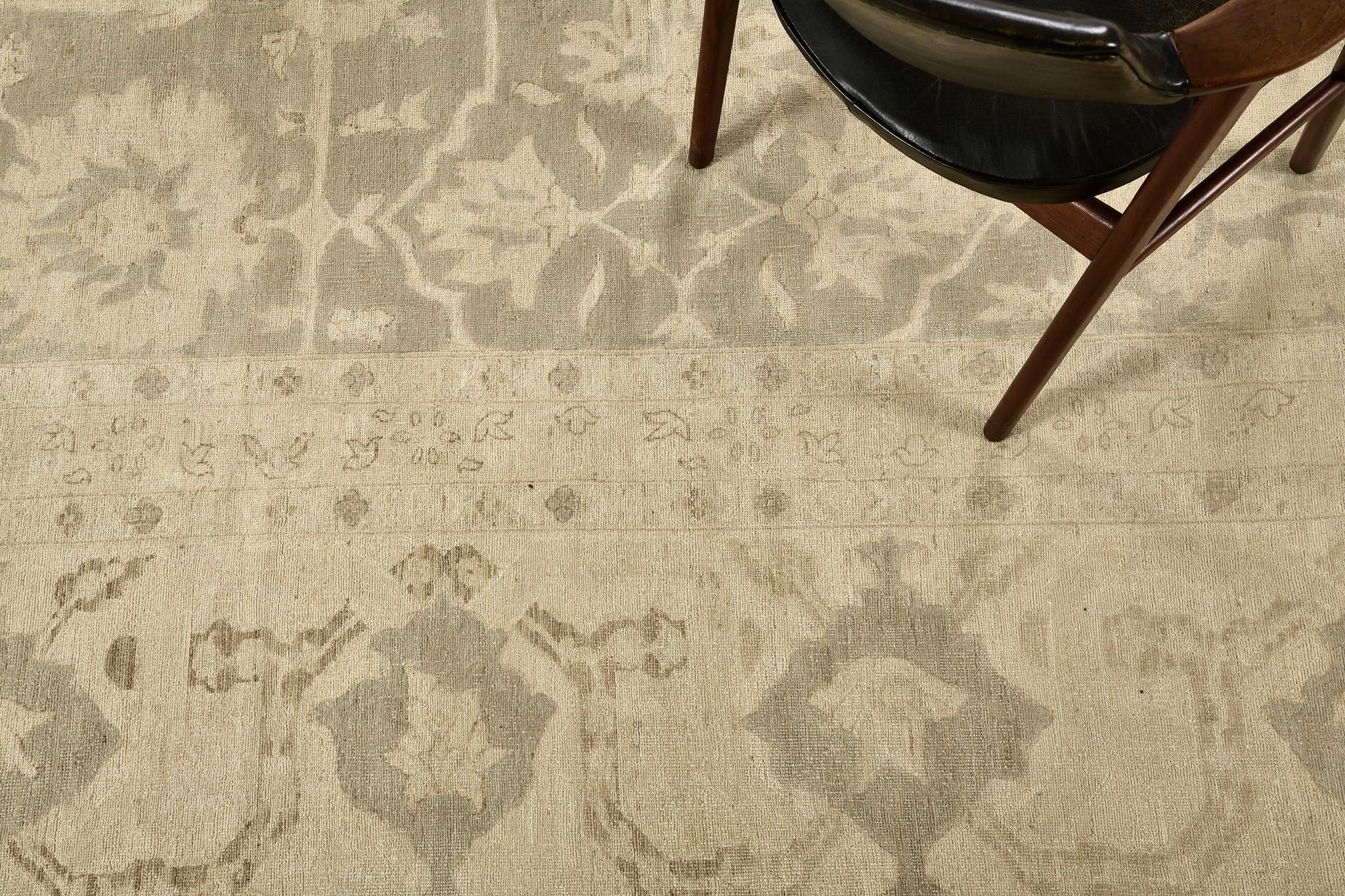 An oversized classic style rug revival from Rapture Collection will be perfect for a traditional home interior. A sage green field with blooming florid and lotus elements, graceful vines, and aligned diamonds as borders, are symmetrically designed.