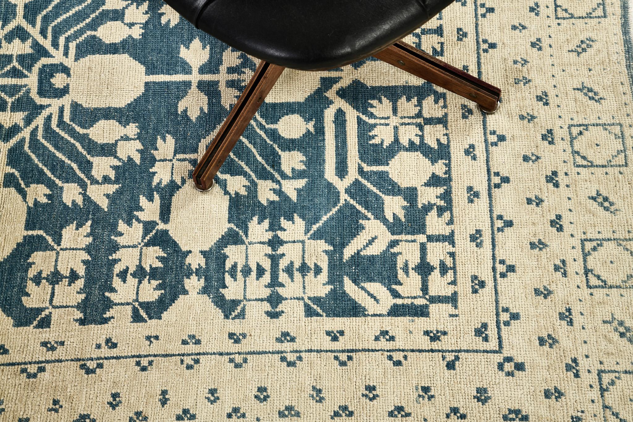 Stylish revival of Khotan Rug from our Safira Collection has an intermittent geometrical patterns flexing its simplicity to achieve your home ideas. Blue hues mirrored pattern field focuses the details of off-white ornaments. Perfect to complement