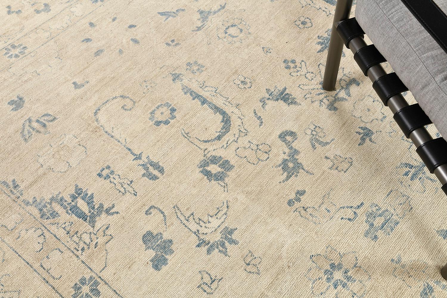 A phenomenal revival of the Oushak rug features neutral tones of the field and vivid outlines of gloomy blue motifs and scrolls. It creates a soulful balance of everything from modern decor to contemporary design. Fill it in your space that every