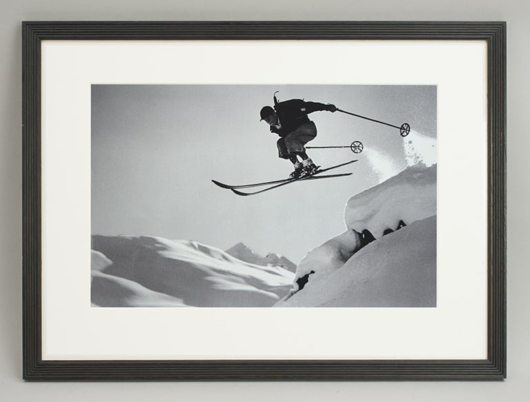 Vintage style Ski Photography, framed Alpine Ski Photograph, Courageous Jump.
'A COURAGEOUS JUMP', a framed and mounted black and white photographic image after an original 1930s skiing photograph. The frame is a hand colored reeded wooden black