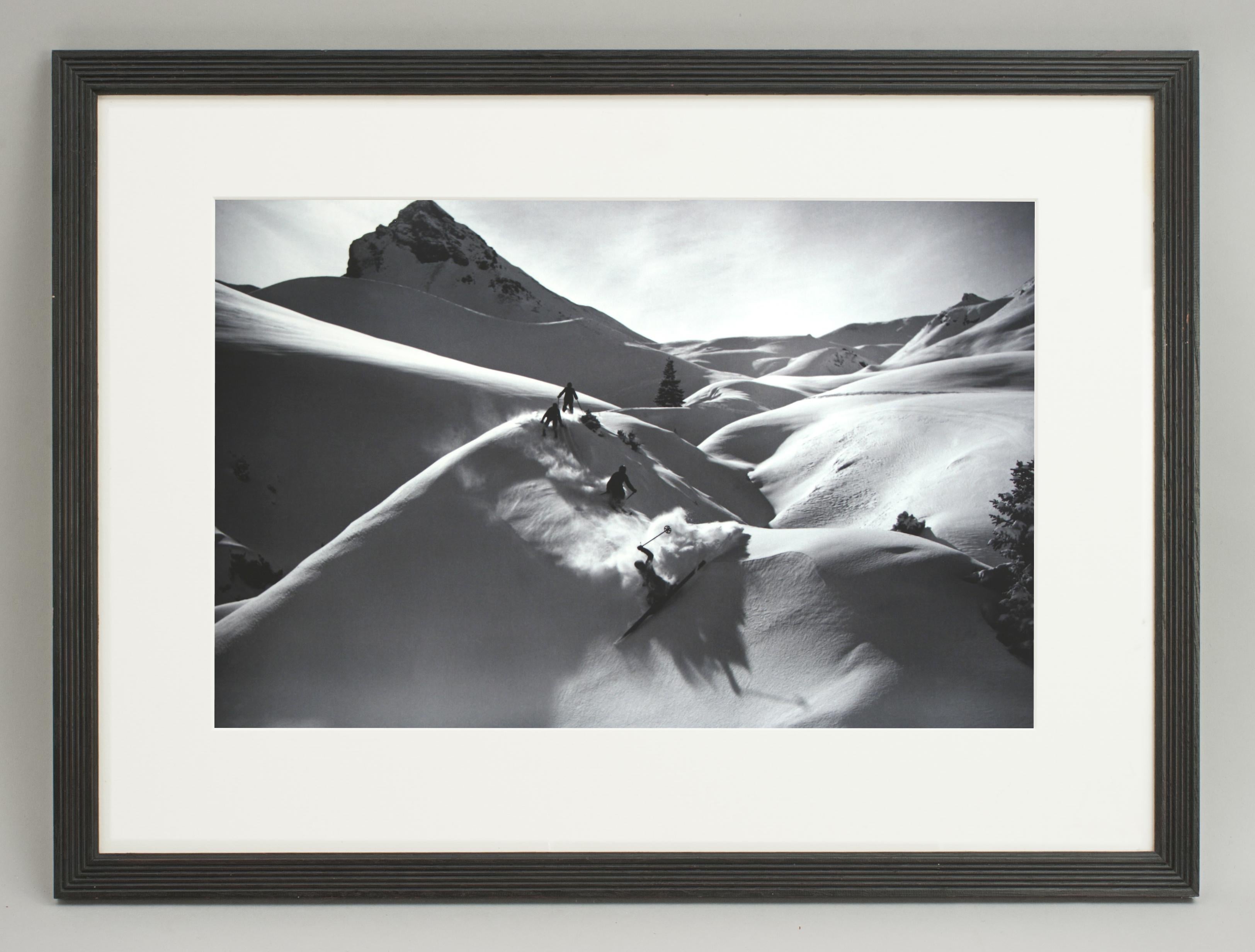 Vintage Style ski photography, framed alpine ski photograph, descent in powder.
'Virgin Powder', a modern framed and mounted black and white photograph after an original 1930's skiing photograph. The frame is black with a burgundy undercoat, the