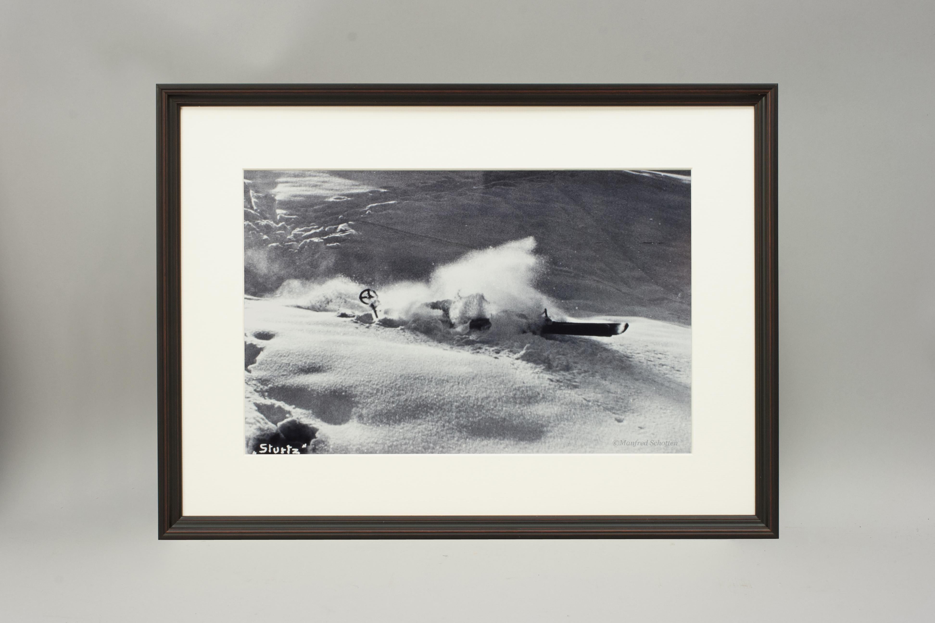 'NOSE DIVE', a modern framed and mounted black and white photograph after an original 1930's skiing photograph. The frame is black with a burgundy undercoat, the glazing is clarity+ premium synthetic glass. Black & white alpine photos are the