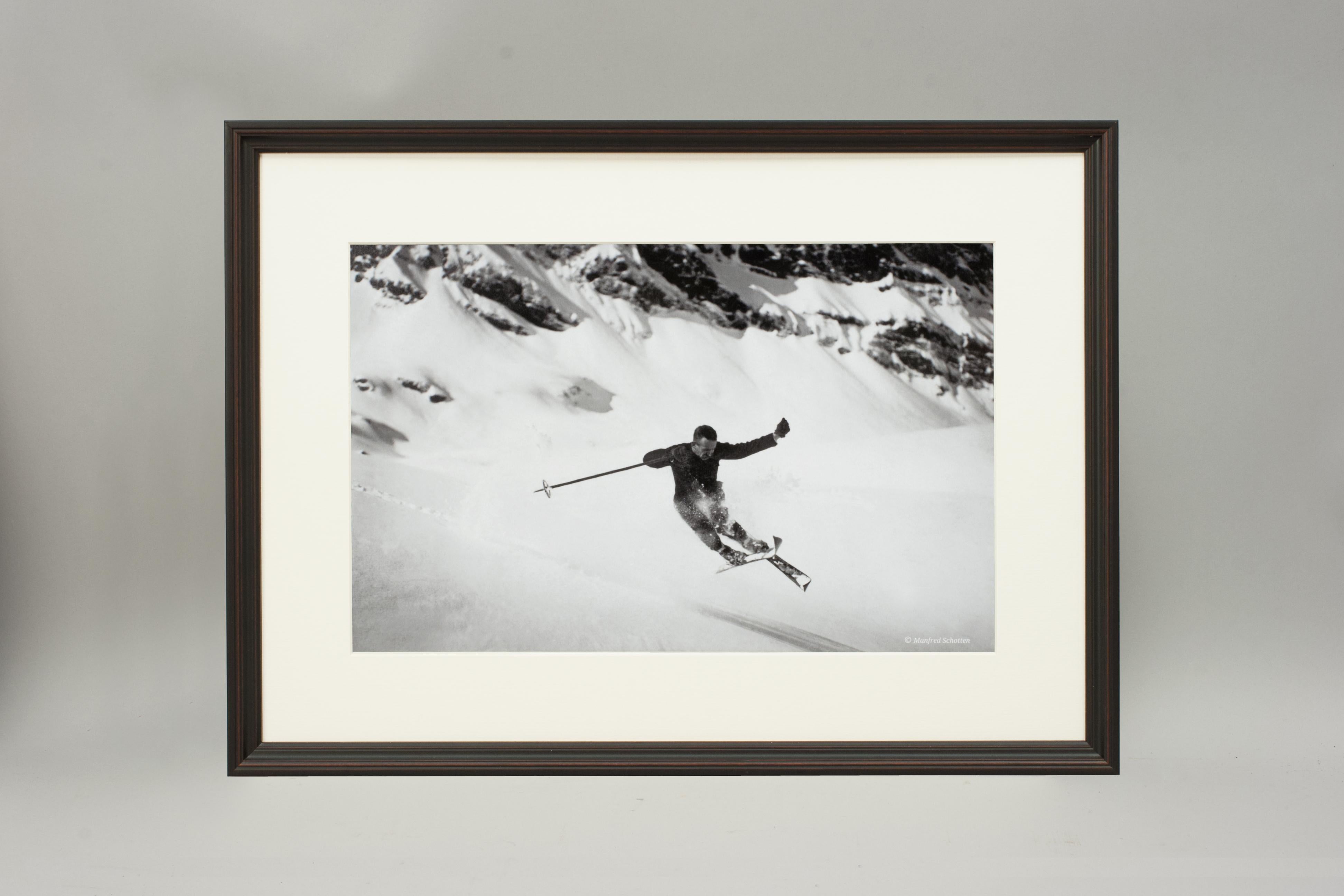 'QUERSPRUNG', a modern framed and mounted black and white photograph after an original 1930's skiing photograph. The frame is black with a burgundy undercoat, the glazing is clarity+ premium synthetic glass. Black & white alpine photos are the