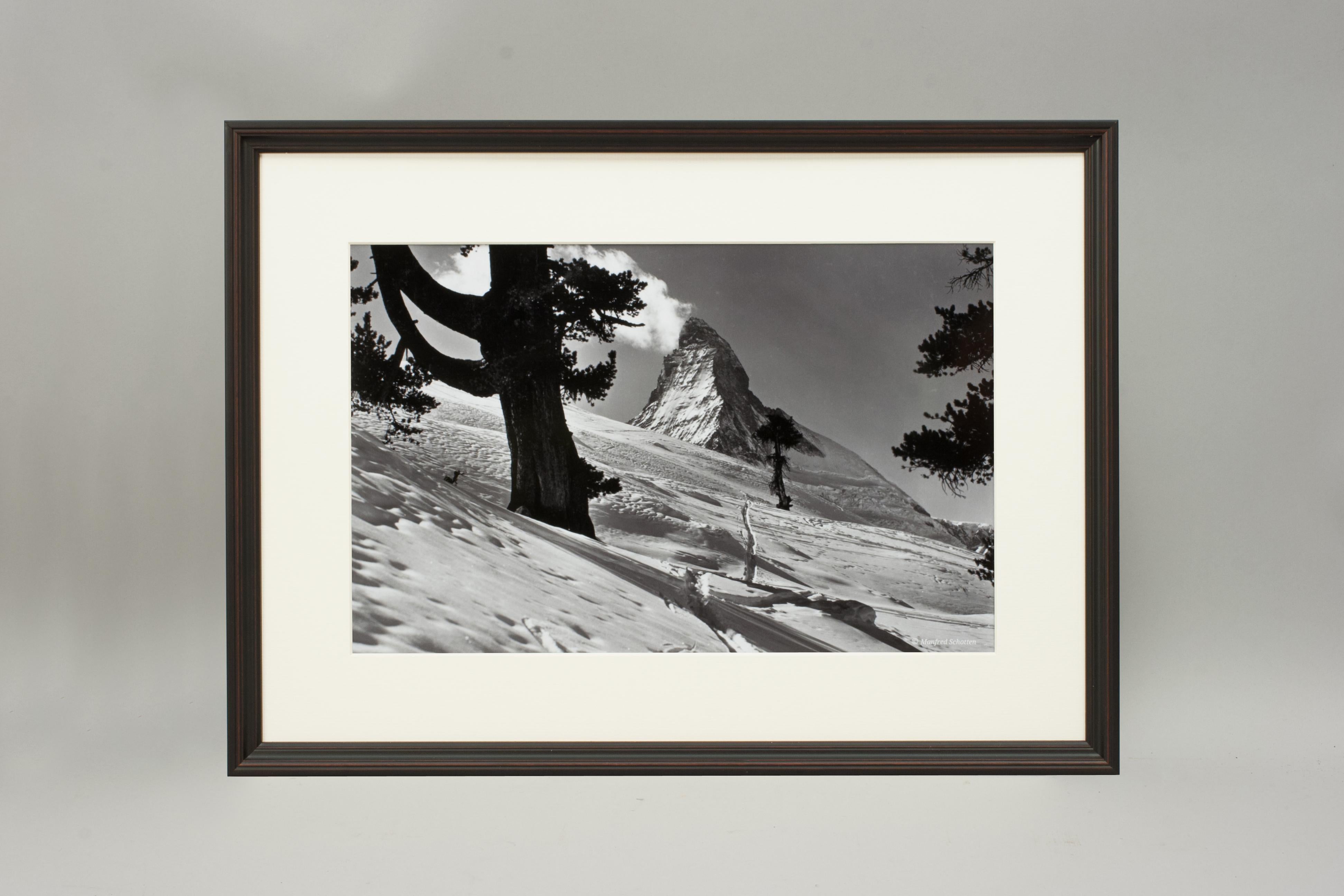 'MATTERHORN', a modern framed and mounted black and white photograph after an original 1930's skiing photograph. The frame is black with a burgundy undercoat, the glazing is clarity+ premium synthetic glass. Black & white alpine photos are the
