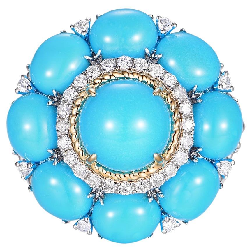 This ring is an exquisite example of fine jewelry, creatively crafted from both 14-karat yellow and white gold. It features a central turquoise stone weighing 1.65 carats, which is the focal point of the piece. This primary turquoise is
