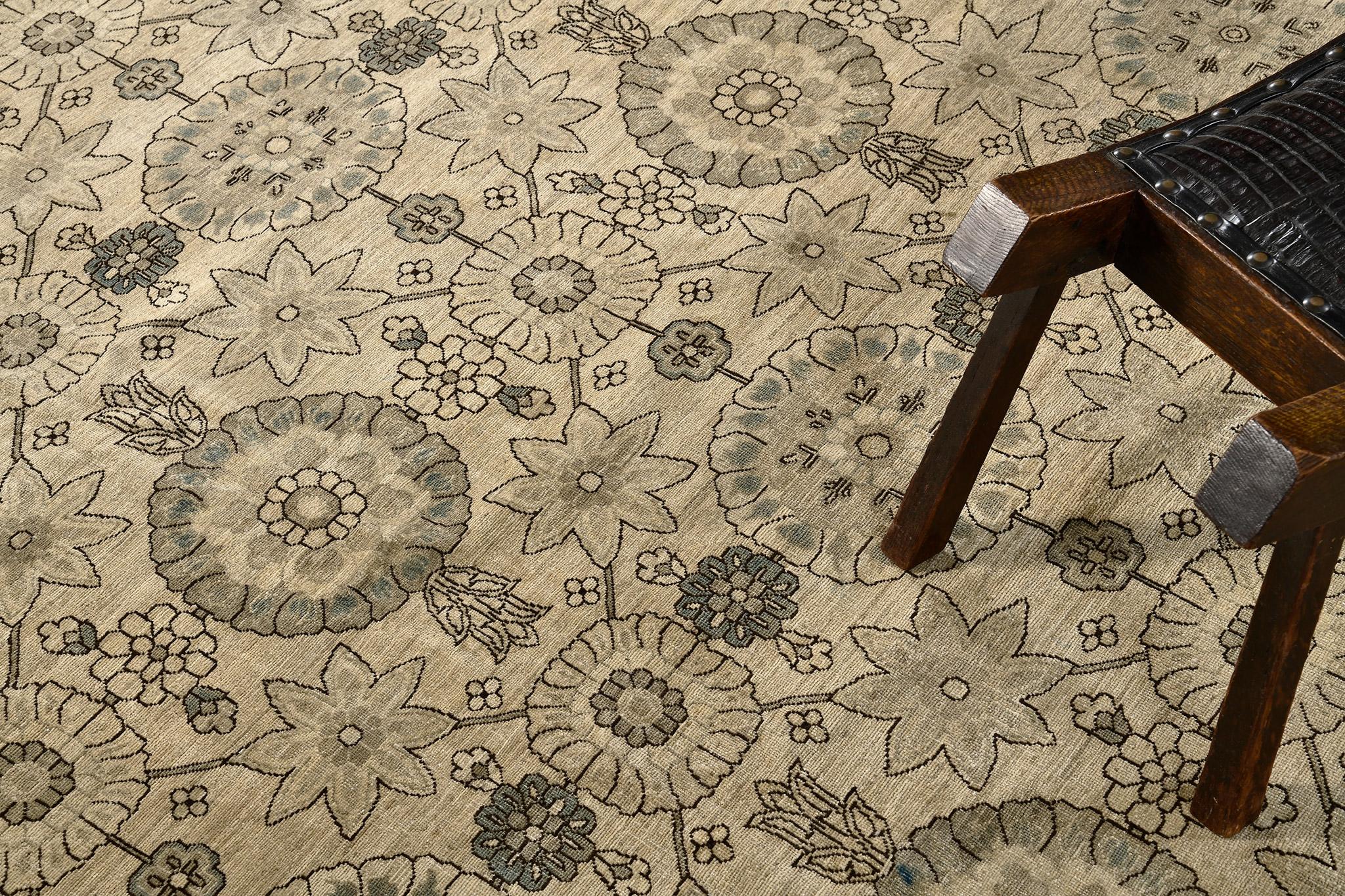 A saturated gray round pattern revival of Tabriz rug that is elegantly styled intermittently. Cypress trees are perfectly sewn with the side of coffee brown florid borders. The type of rug that perfectly fits in both traditional and modern home