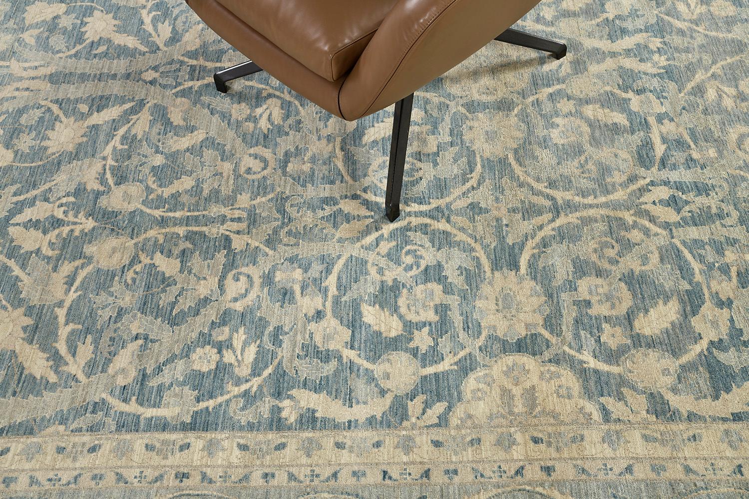 Lovely vines and florid adornments are expressed through gold embellishments to blooming and fascinating dusty blue fields. The borders are beautifully woven that created vigorously to form an elegant Zigler Rug. Truly an extraordinary creation that