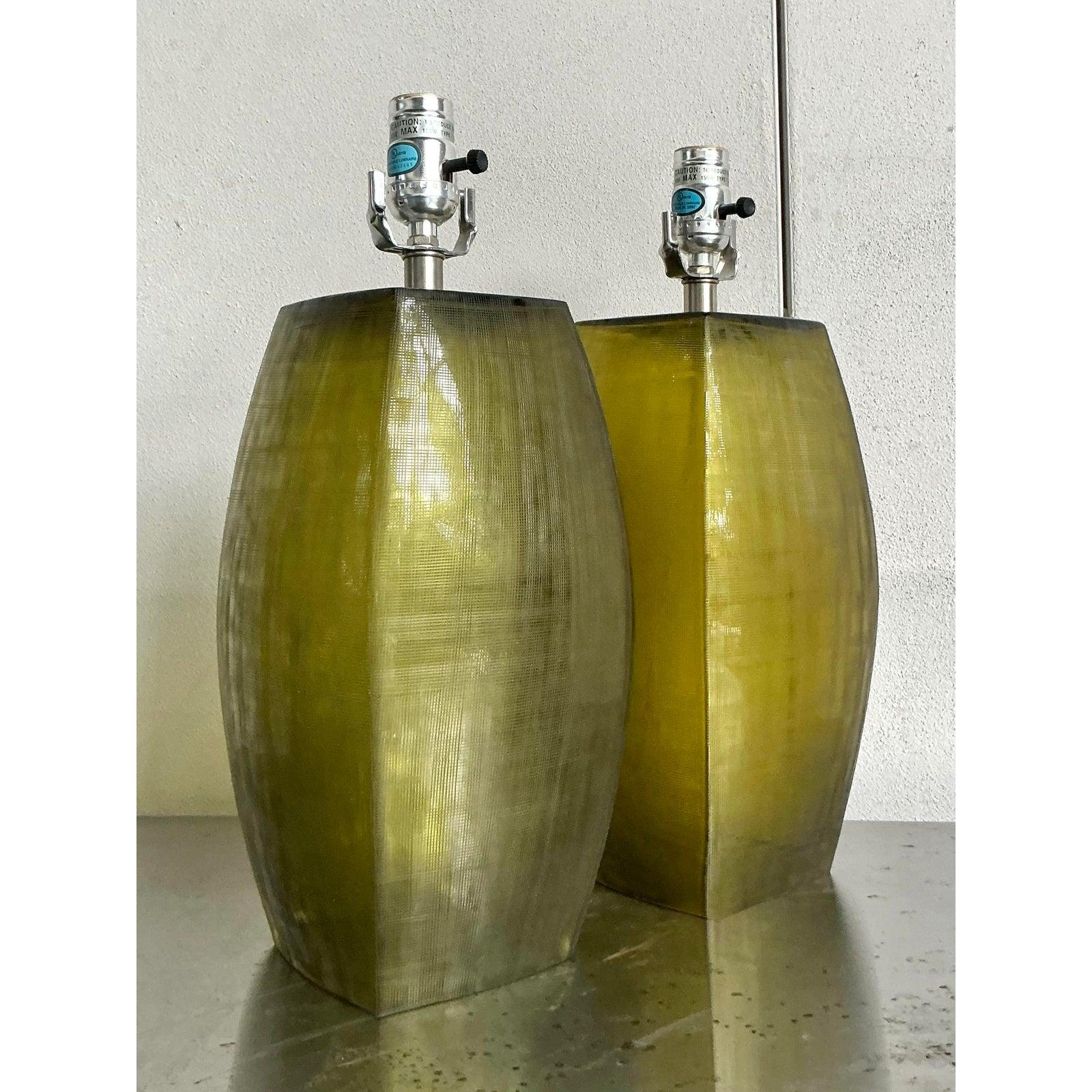 Presenting a stunning pair of vintage etched glass lamps, inspired by the distinctive aesthetic of Donghia, perfect for illuminating and enhancing any sophisticated interior. These lamps exude a unique Boho charm with their subtly textured, etched