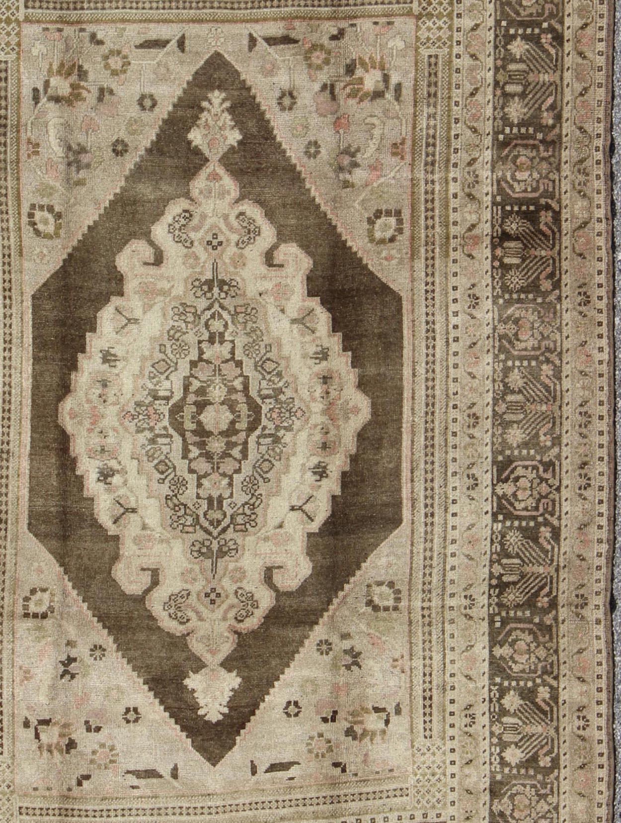 Hand-Knotted Vintage Stylized Medallion Turkish Oushak Area Rug in Neutral Beiges and Browns For Sale