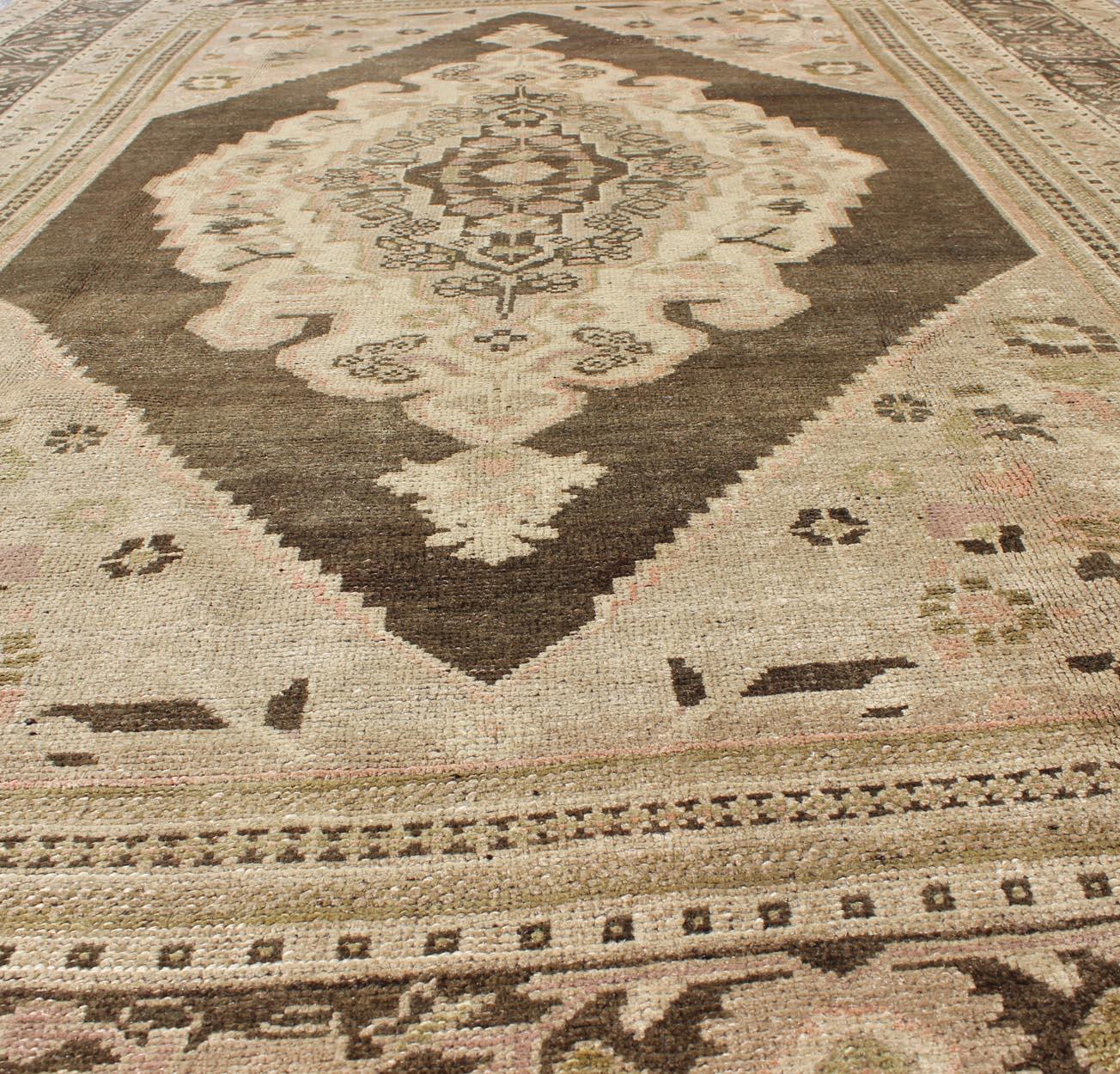 Wool Vintage Stylized Medallion Turkish Oushak Area Rug in Neutral Beiges and Browns For Sale