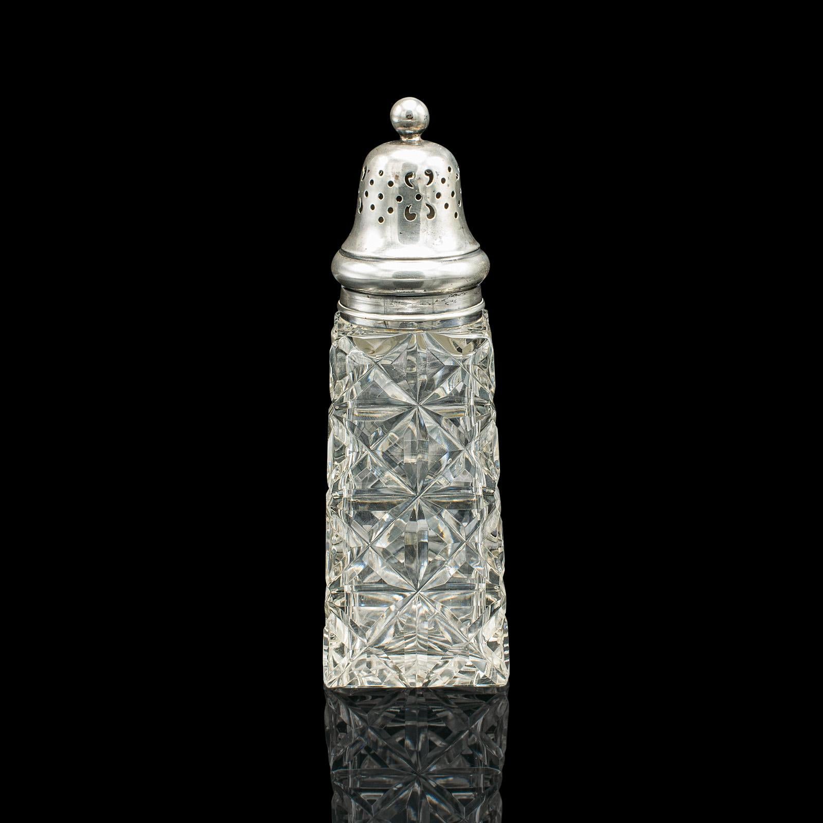 This is a vintage sugar shaker. An English, cut glass and sterling silver caster by James Deakin & Son, dating to the early 20th century, hallmarked in 1929.

Add a dash of glamour to the breakfast table or afternoon tea
Displays a desirable aged