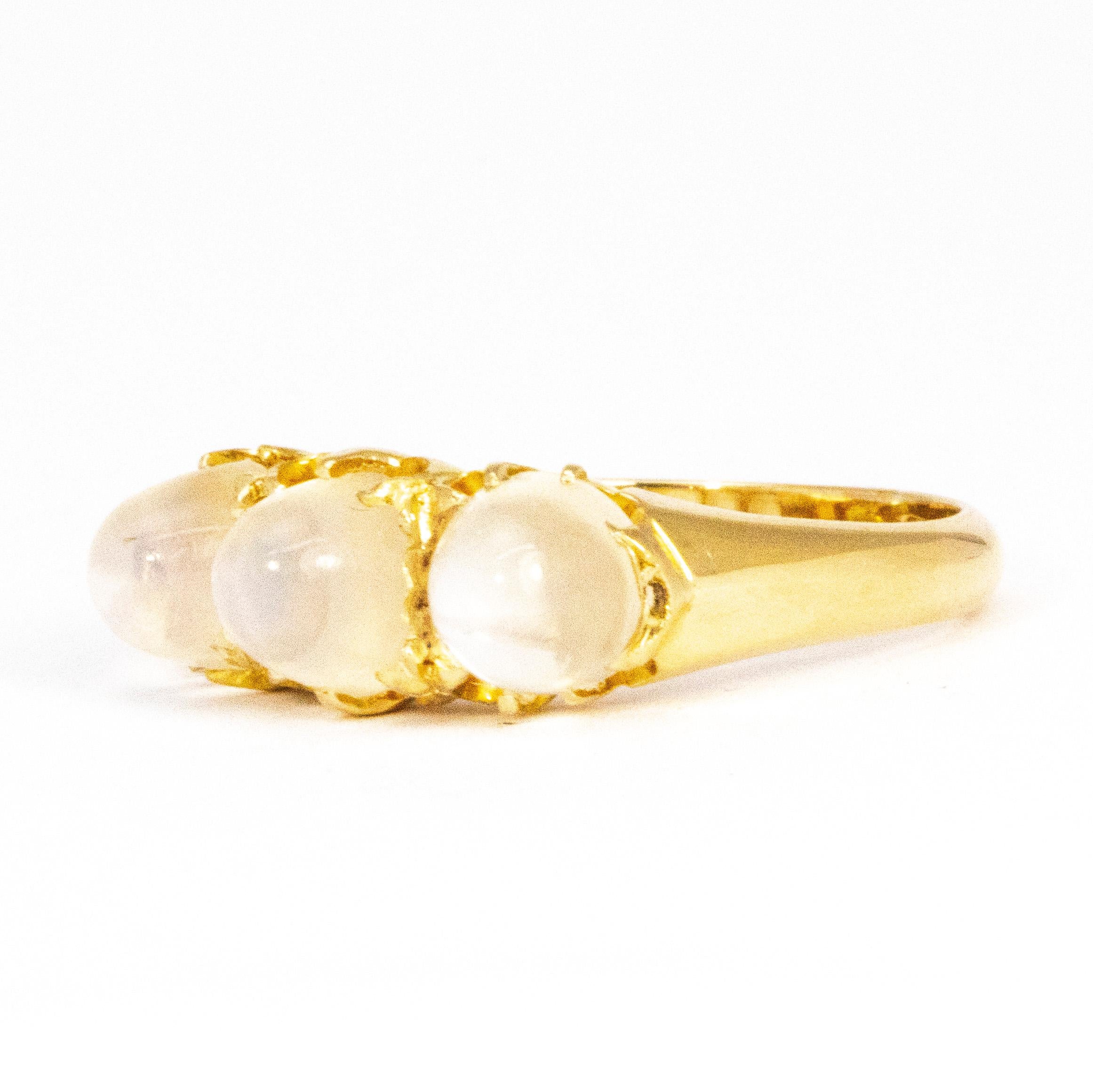 Sat in this glossy 18carat gold band are three gorgeous sugarloaf moonstones. The settings are simple claw settings so thy do not take away from the stones themselves. 

Ring Size: N or 6 1/2 
Height Off Finger: 7mm 
Band Width: 6.5mm 
