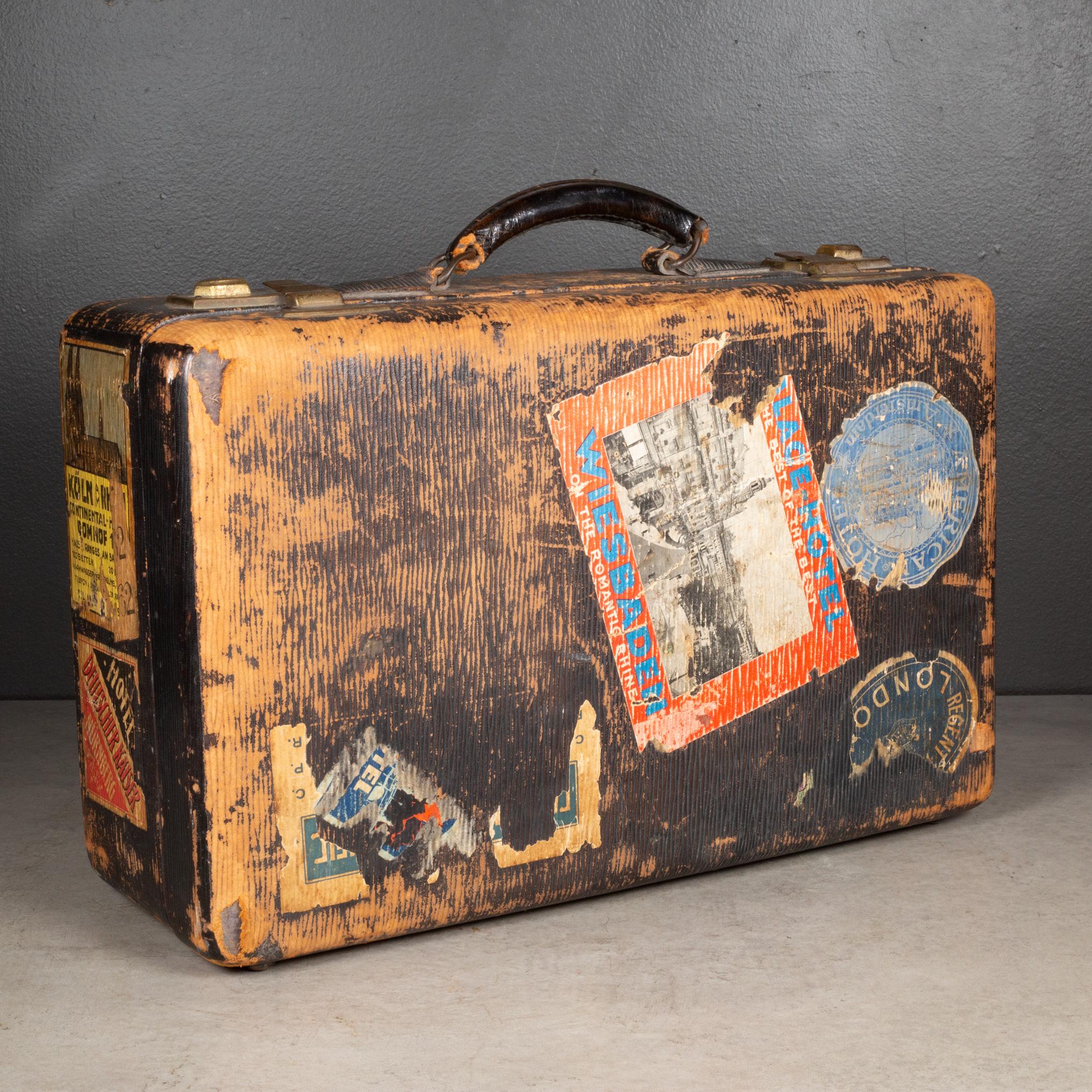 ABOUT

A suitcase with leather handle and corners, original travel stickers and two keys. The locks and large hinges are brass and open properly. The suitcase is monogrammed 