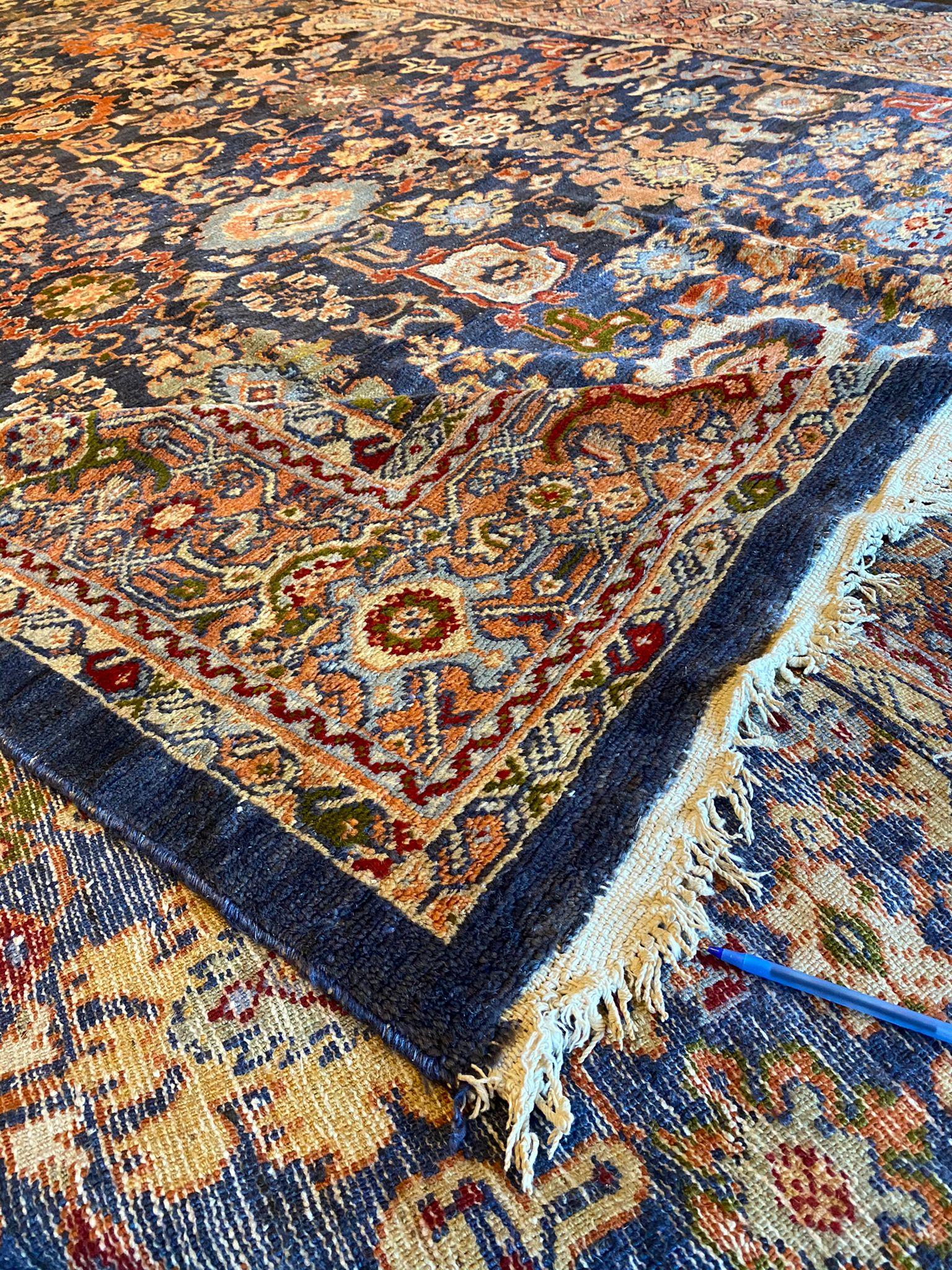 A Vintage Sultanabad Rug of this size and quality is not only a floor covering but a work of art that can define and elevate the aesthetic of an entire room. Its intricate design, vivid colors, and timeless appeal make it a prized possession for