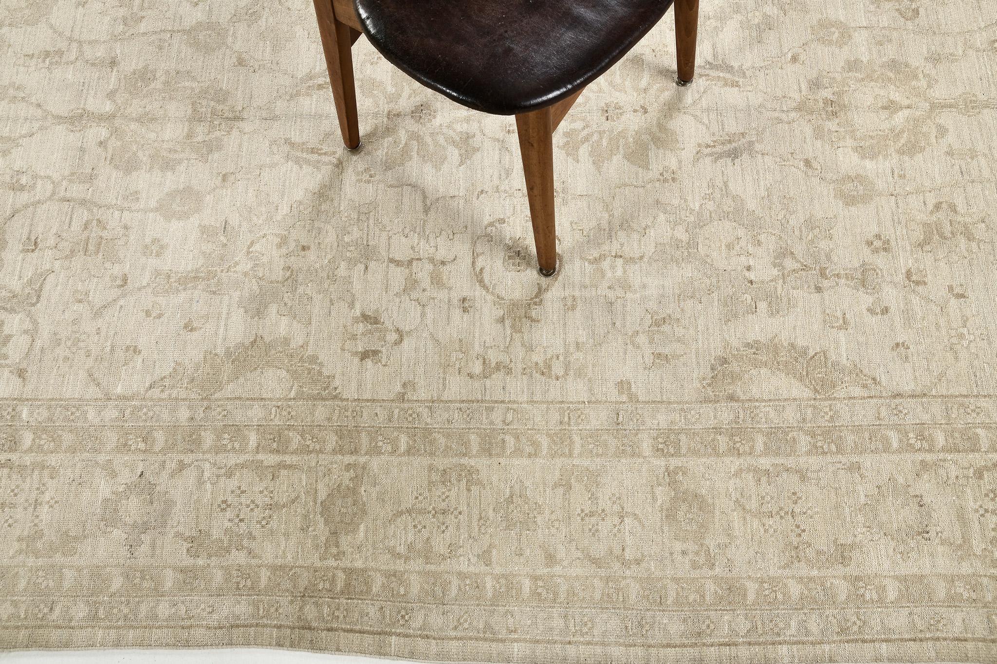 A majestic revival of Sultanabad design rug in the stunning muted neutral tones that come together and gave the feeling of genuine serenity. An all-over pattern of blooming palmettes and interconnected vines enclosed by an embellished ornate box