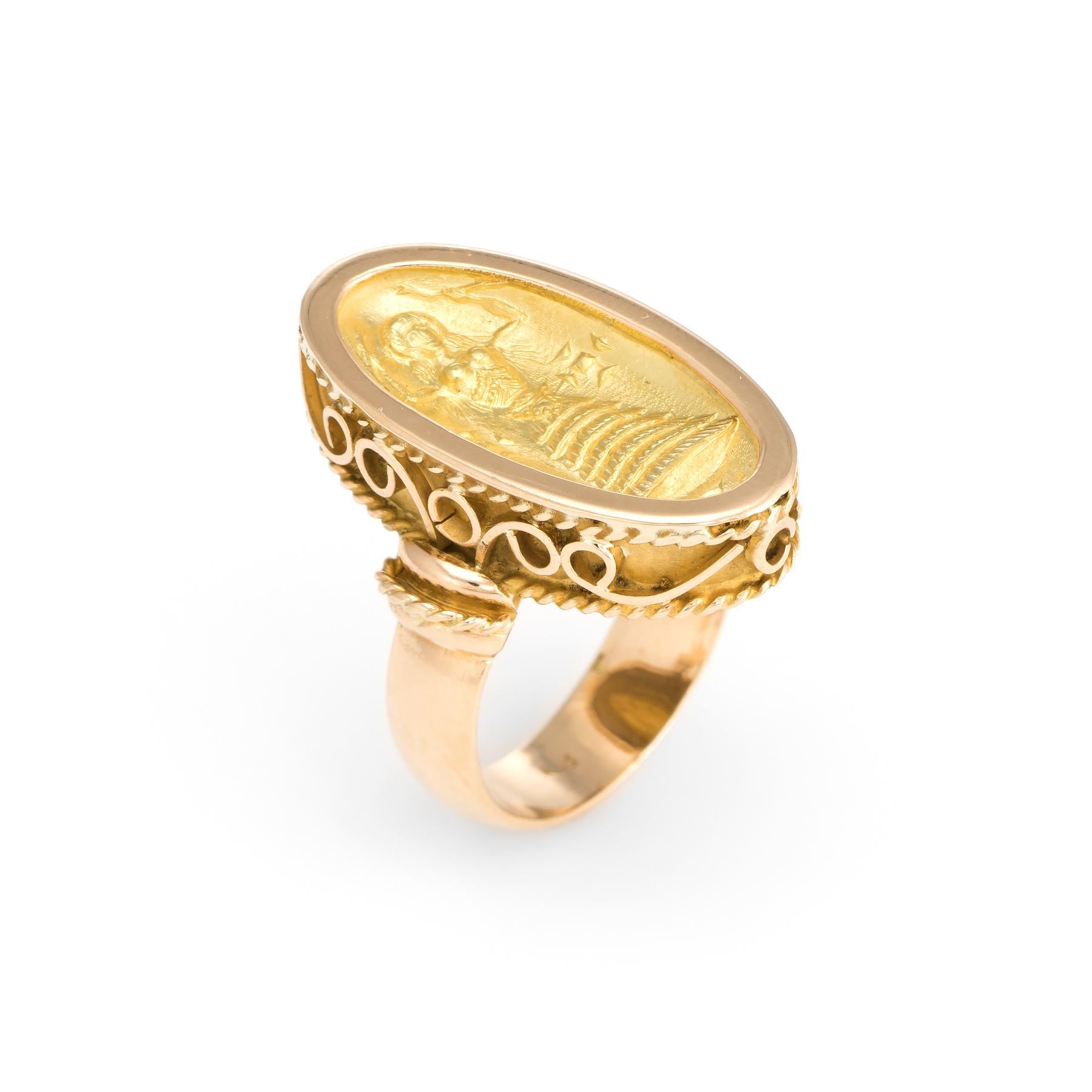 Distinct & stylish cocktail ring, crafted in 18 karat yellow gold. 

The oval mount features a recessed depiction of Inanna, the ancient Sumerian goddess of love, sensuality, fertility, procreation and also of war. Here she is depicted as the