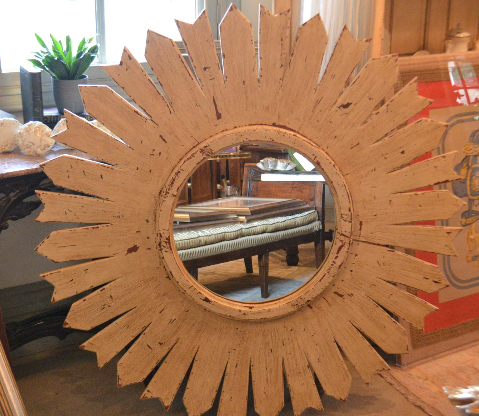 Vintage sunburst mirror in wooden frame, France.