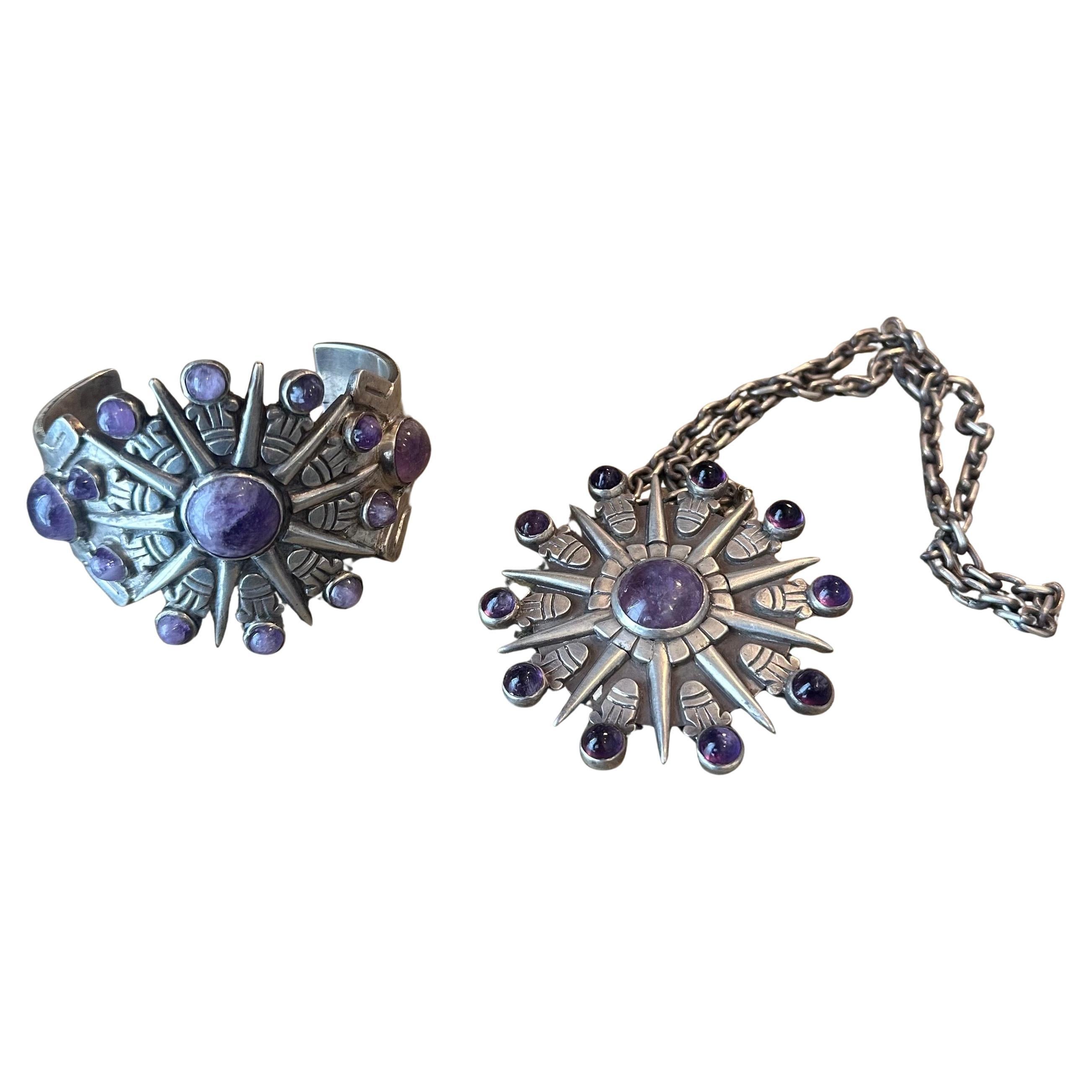 Fabulous vintage sunburst Mexican silver and cabochon amethyst cuff bracelet and necklace / pendant / brooch by William Spratling, circa 1940s.   The bracelet measures 2.625