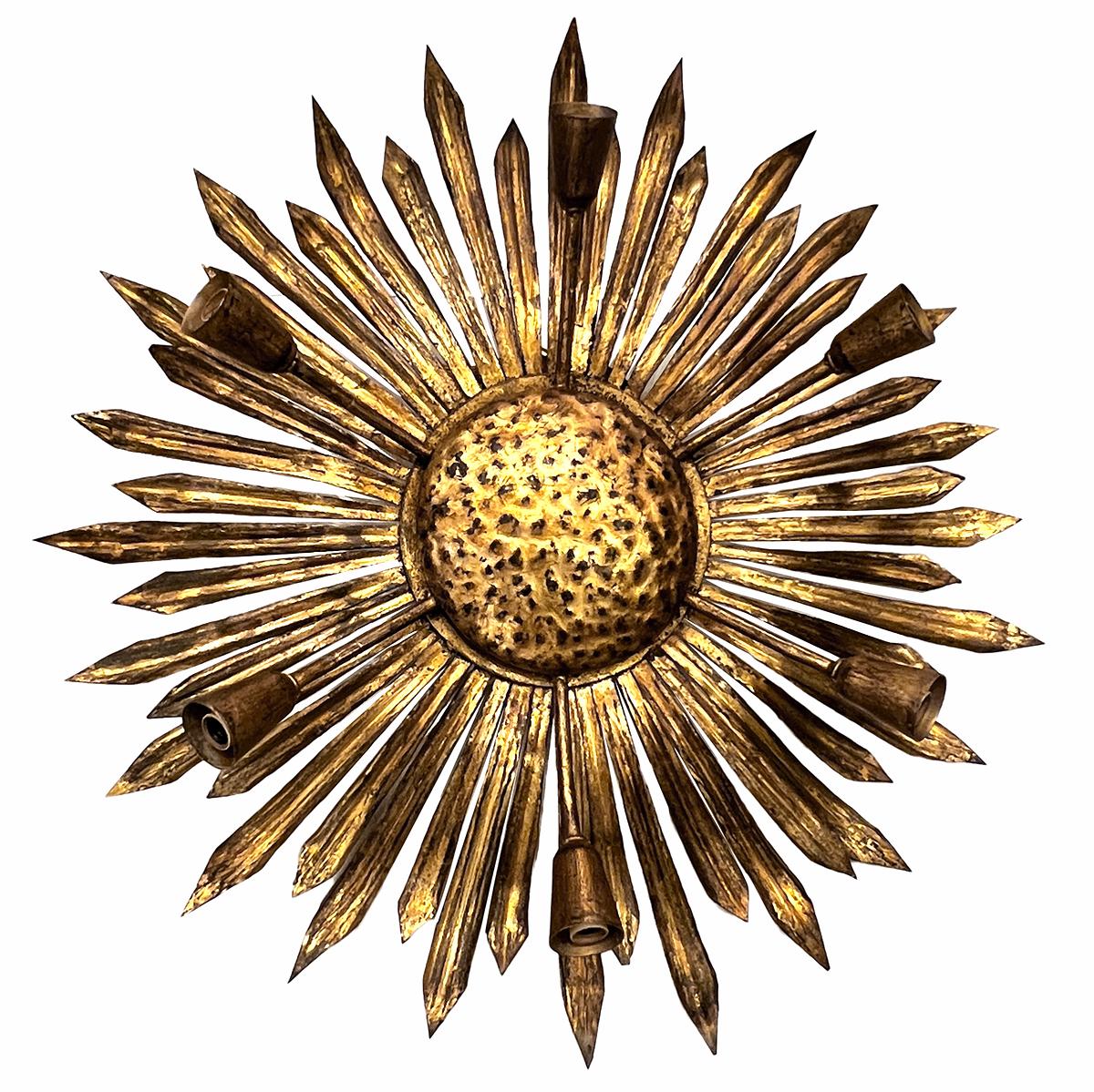 A circa 1960 French gilt metal light fixture with lights.

Measurements:
diameter: 28