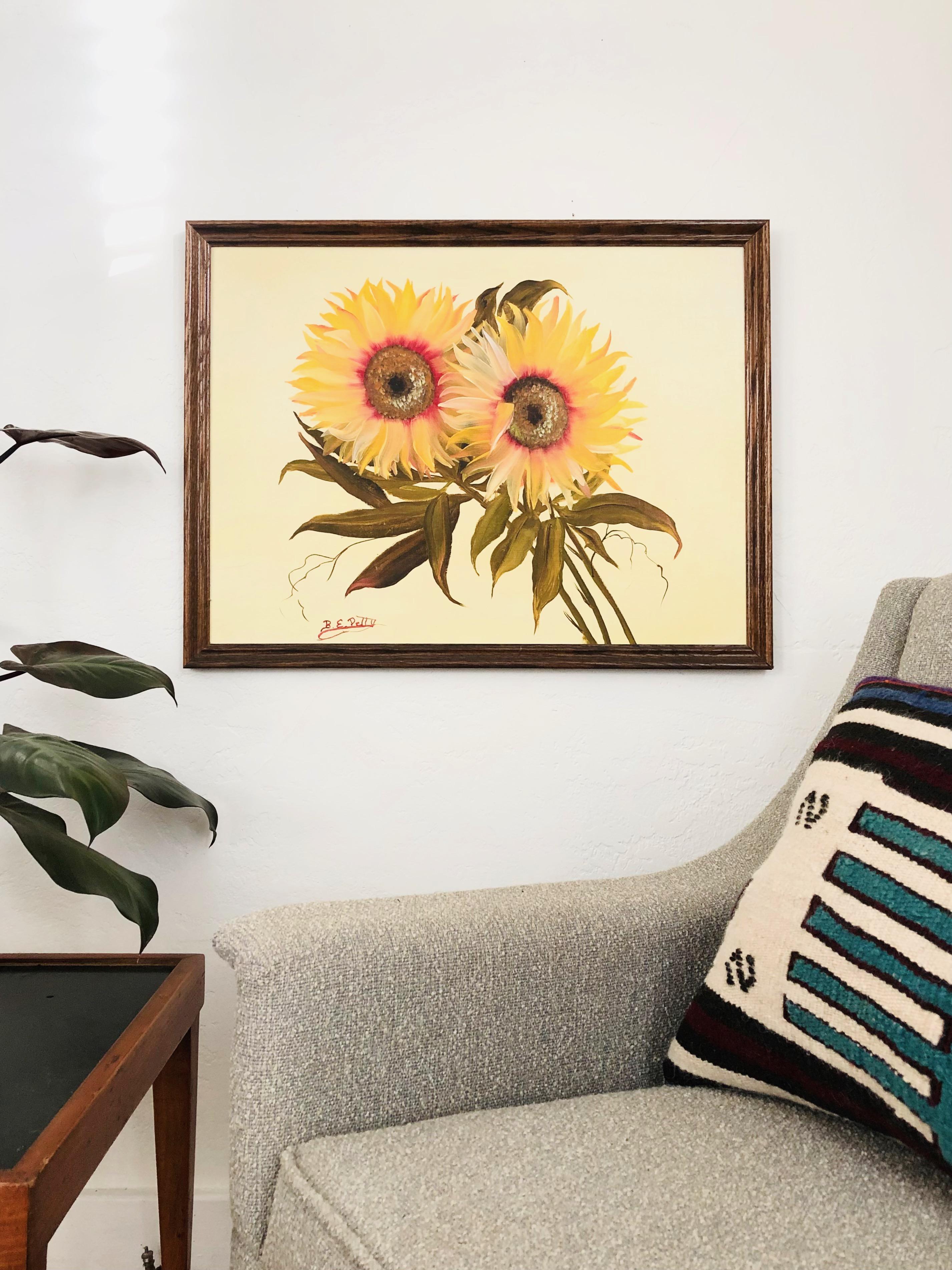 An original vintage oil painting on board of sunflowers. Great movement to the brushstrokes. Mounted in a wood frame and signed by the artist along the bottom.
 