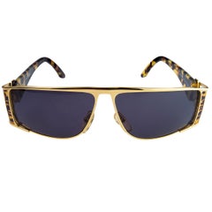 Vintage sunglasses by Von Furstenberg, made in Italy. Gold aviators