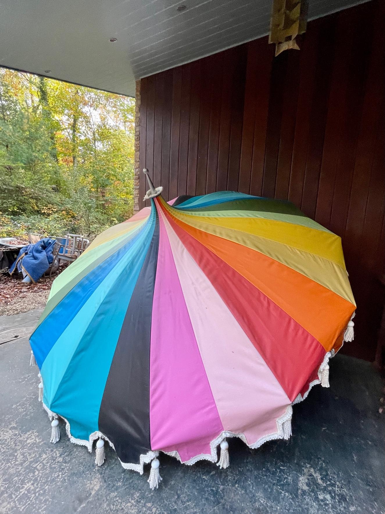 No base or extension poles are included.

This is a vintage 1960's Sunmaster umbrella, made in Costa Mesa, California.   Massive 8 foot diameter. The colors are so amazing, with a big top Circus Style.  The edges have tassels and fringe along the