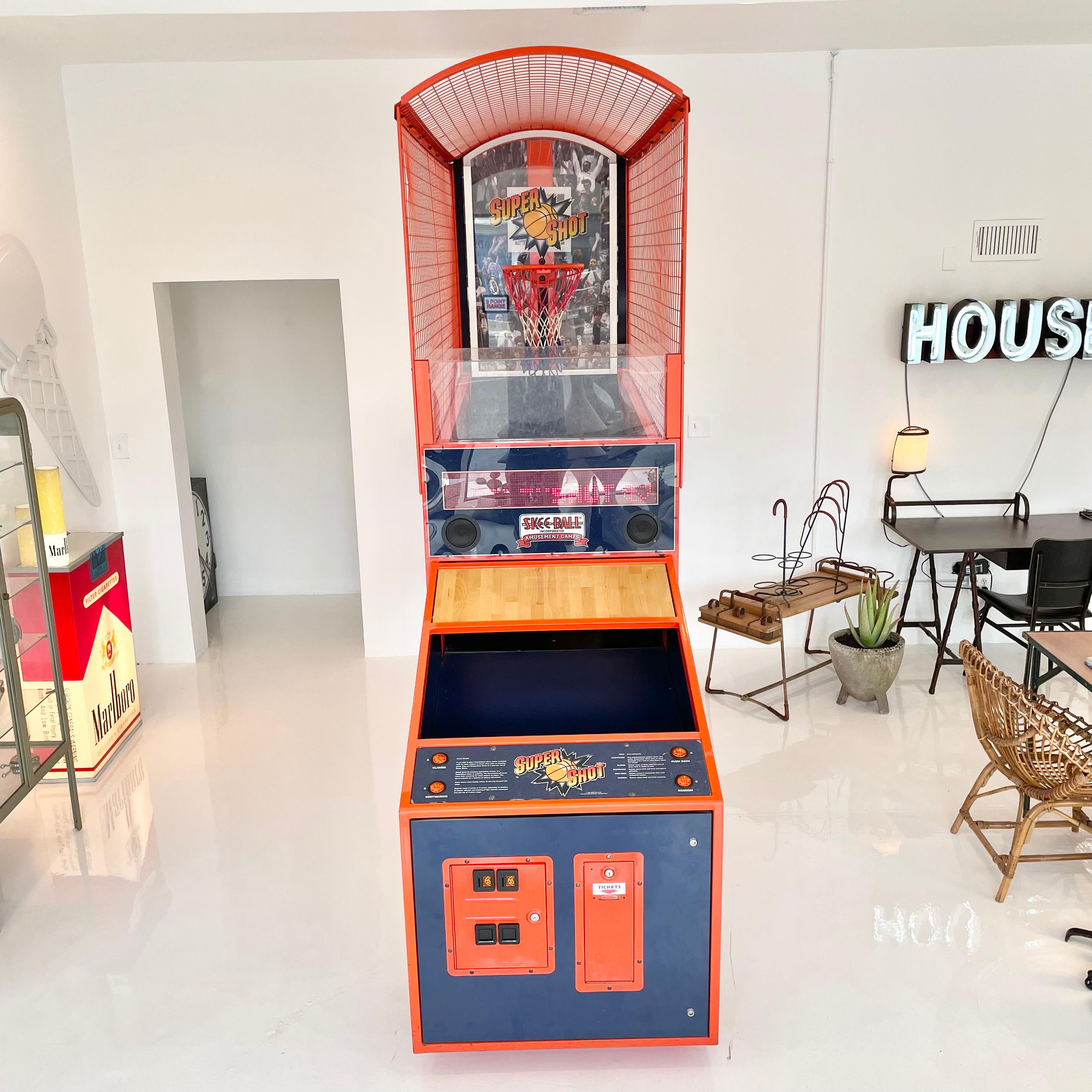 Super shot basketball arcade game made by Skee-Ball. The acrylic backboard moves back and forth for 2 and 3 point baskets/points. 4 different game modes. Perfect working order. Fun piece of nostalgia rom the arcade game era of the 80s and 90s. Comes