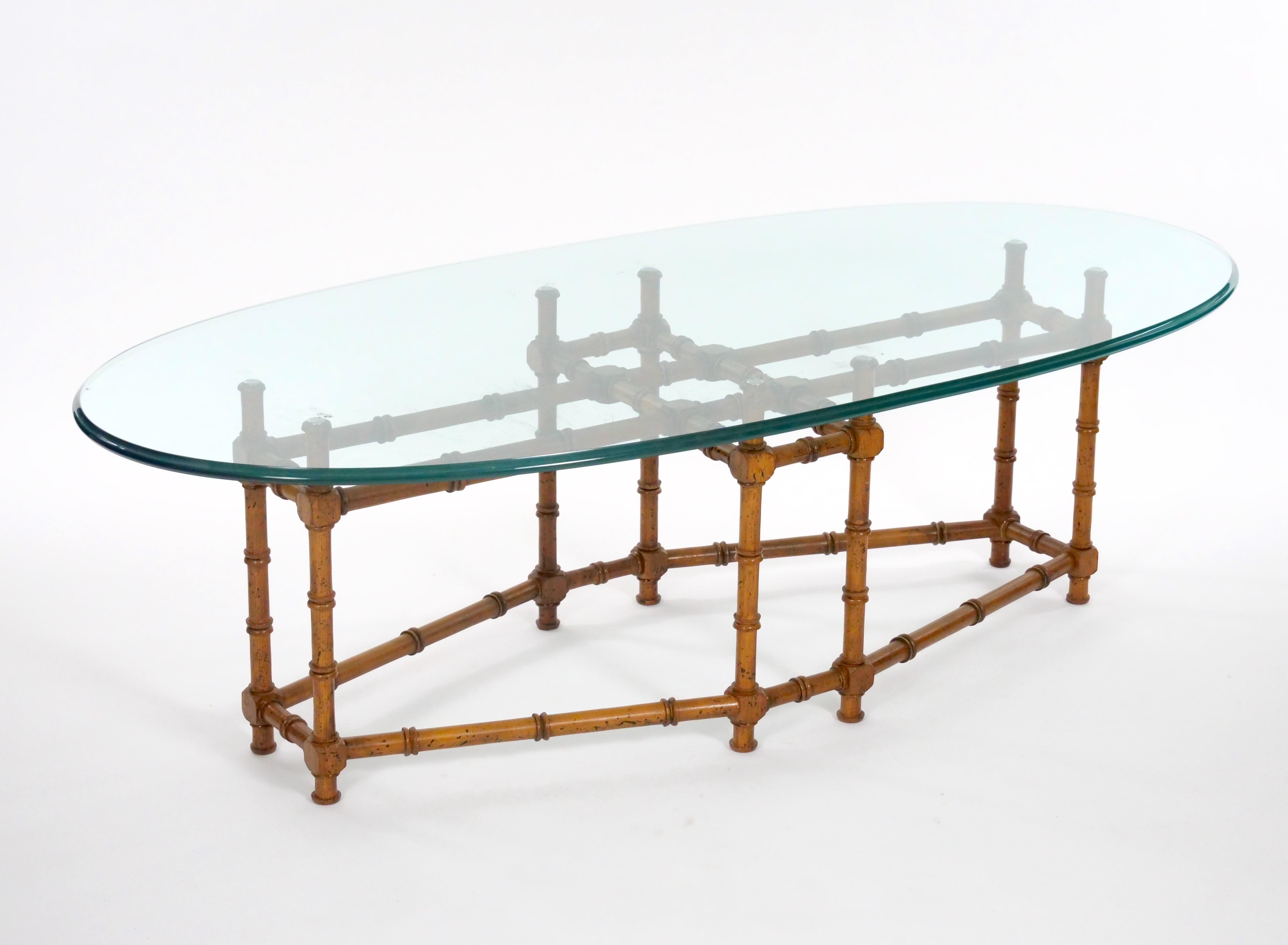 
Introducing a captivating Mid-20th Century coffee table with a distinctive surfboard shape glass top and a faux bamboo base, exuding both style and charm. This vintage piece is in good condition, showcasing the enduring appeal of mid-century