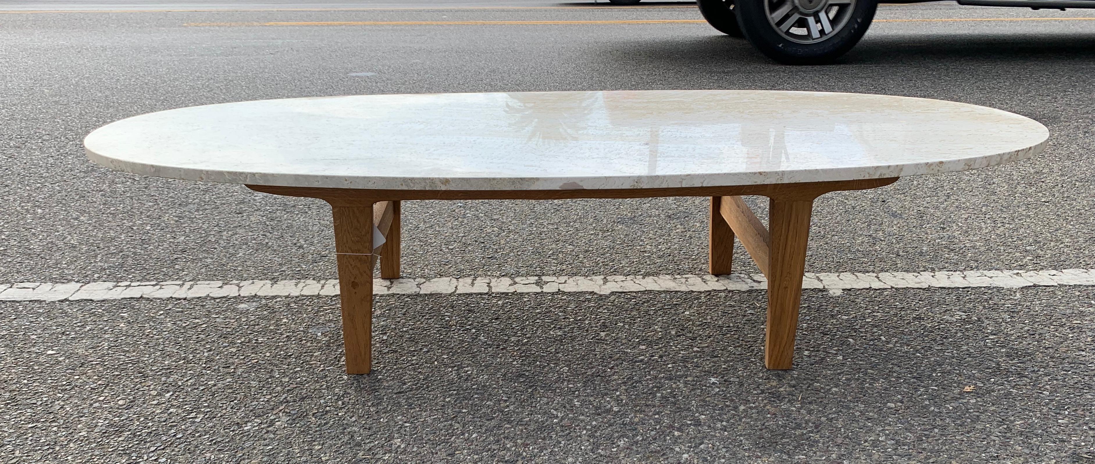 Sleek surfboard travertine top Vintage coffee table. Warm solid Travertine with solid white oak base 