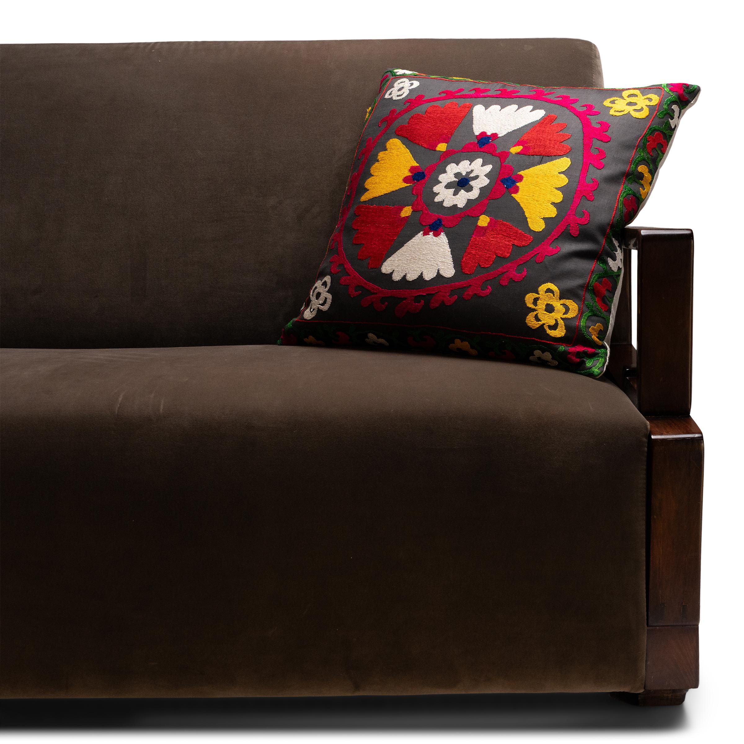 This hand-crafted pillow was designed by a local Chicago artist and textile historian who lovingly repurposes the vintage fabrics, garments and embroidery fragments she collects during her travels. Down-filled and backed with off-white linen, this