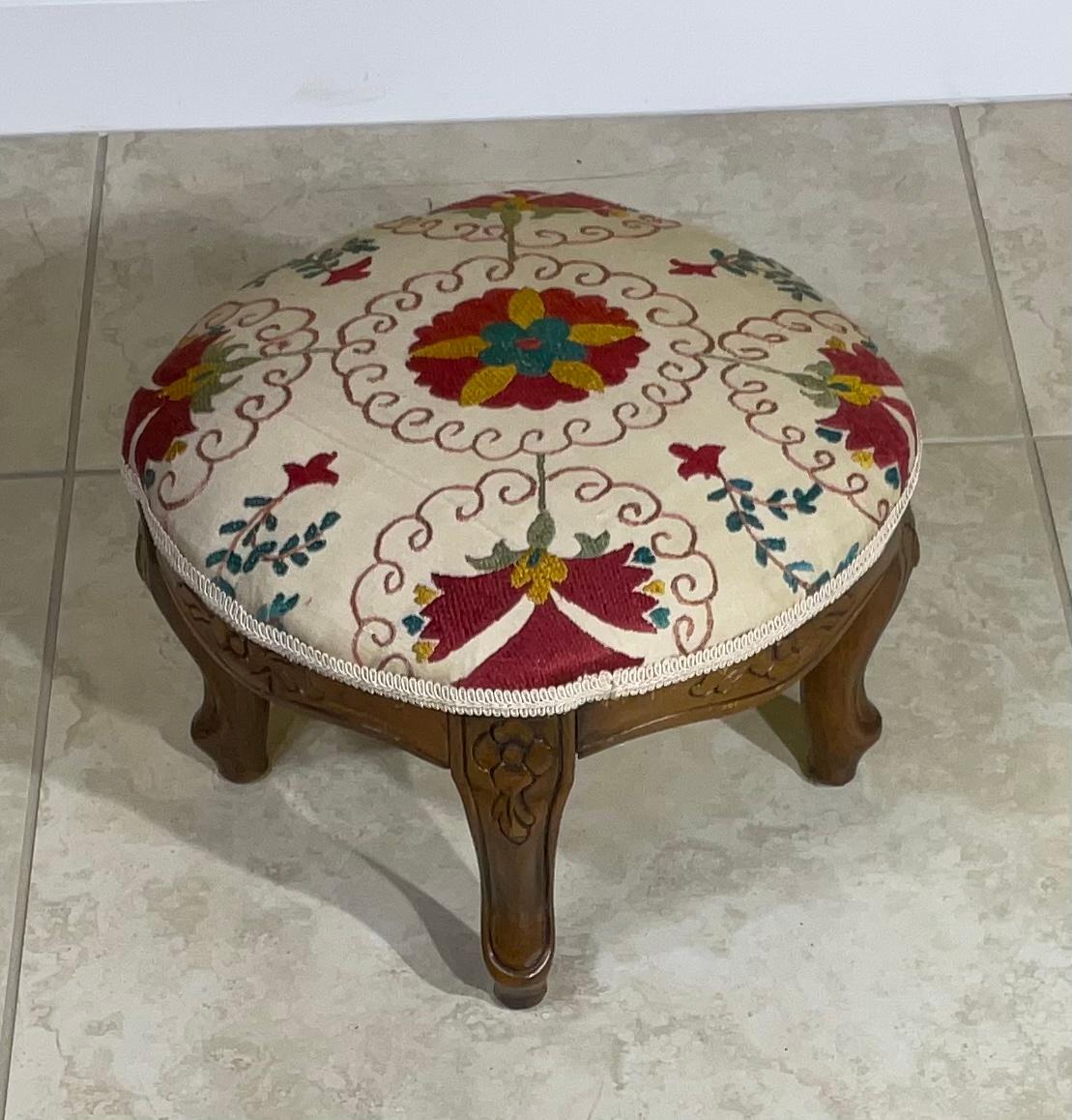 Exceptional vintage foot stool made of hand carved wood upholster with beautiful hand embroidery Suzani textile.
Great decorative item for any room.
