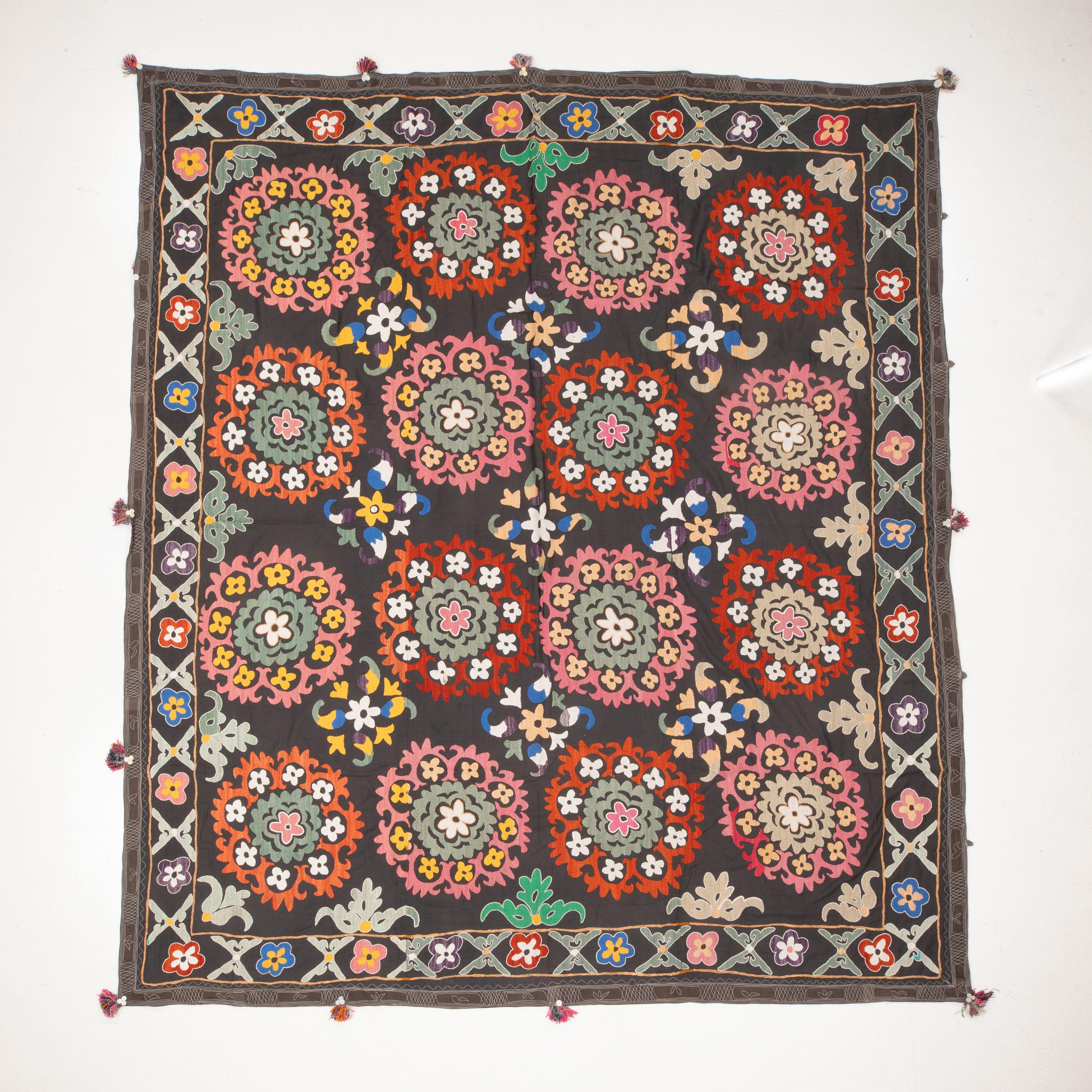 The suzani above is a vintage and used one therefore it is not in brand new condition. It has traces of age and use but nothing to hurt the eye.


General Info On Suzanis

Uzbek Suzani, a captivating textile art form originating from Central Asia,