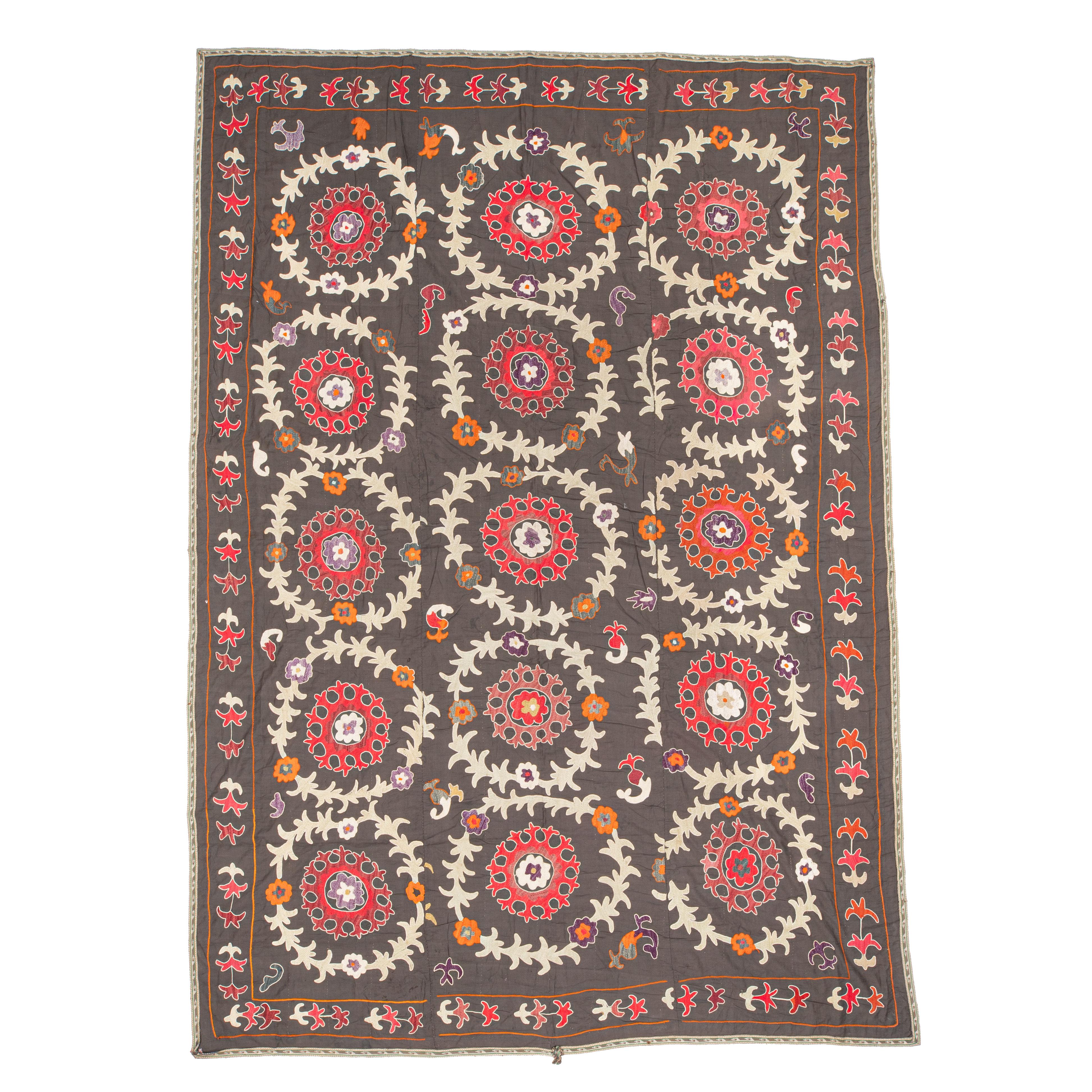 The suzani above is a vintage and used one therefore it is not in brand new condition. It has traces of age and use but nothing to hurt the eye.


General Info On Suzanis

Uzbek Suzani, a captivating textile art form originating from Central Asia,