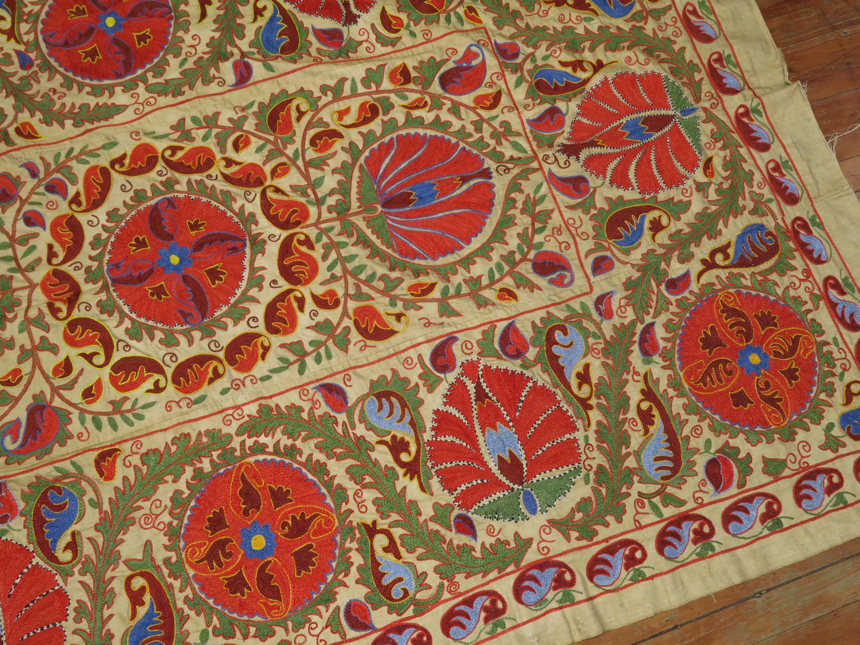 One of a kind colorful hand embroidered Suzanni textile. Measures: 58” x 86”.