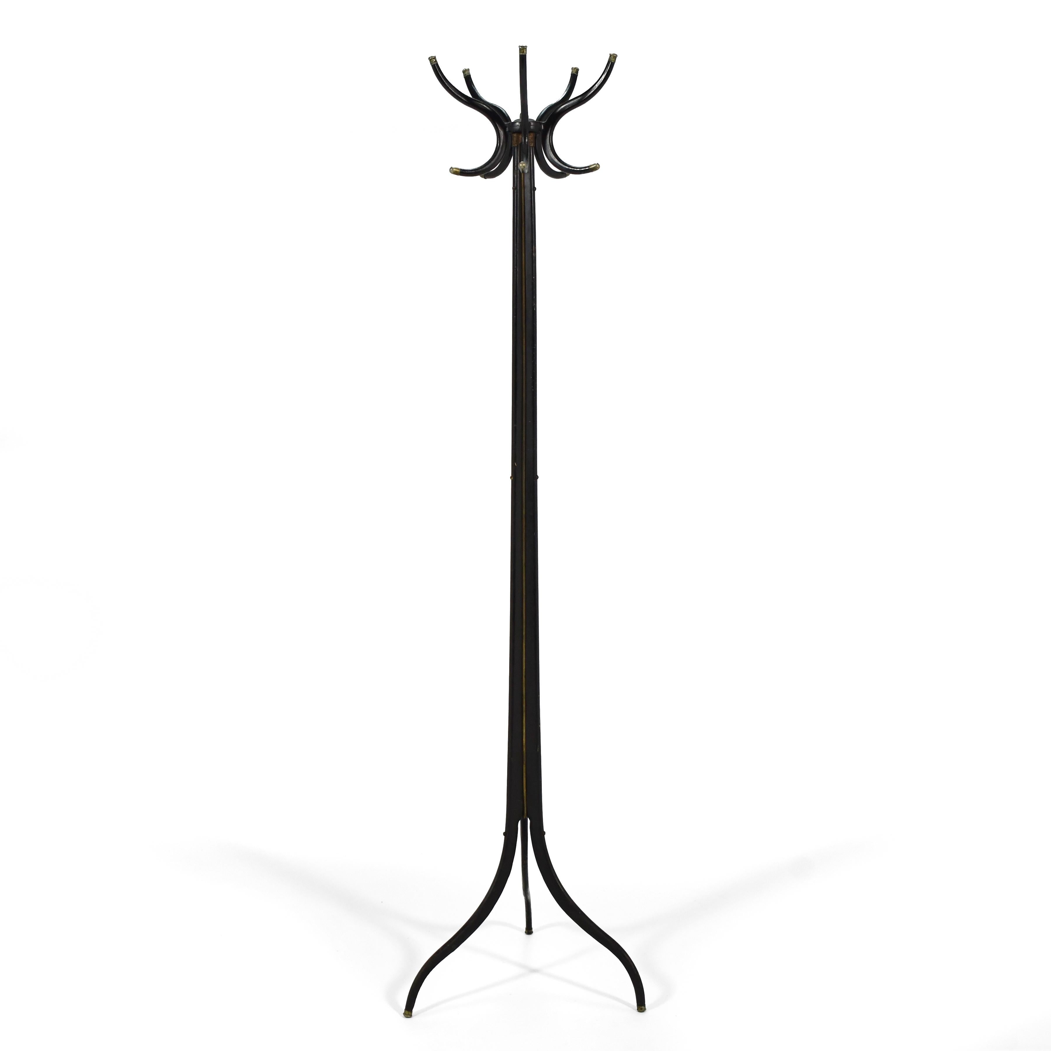 This elegant, sculptural coat rack is made of steel with a swiveling head and three legs that are swagged (tubular legs that are bent into a curve as they taper, using pressure) just like the famous design by Charles Pollock and Irving Harper for