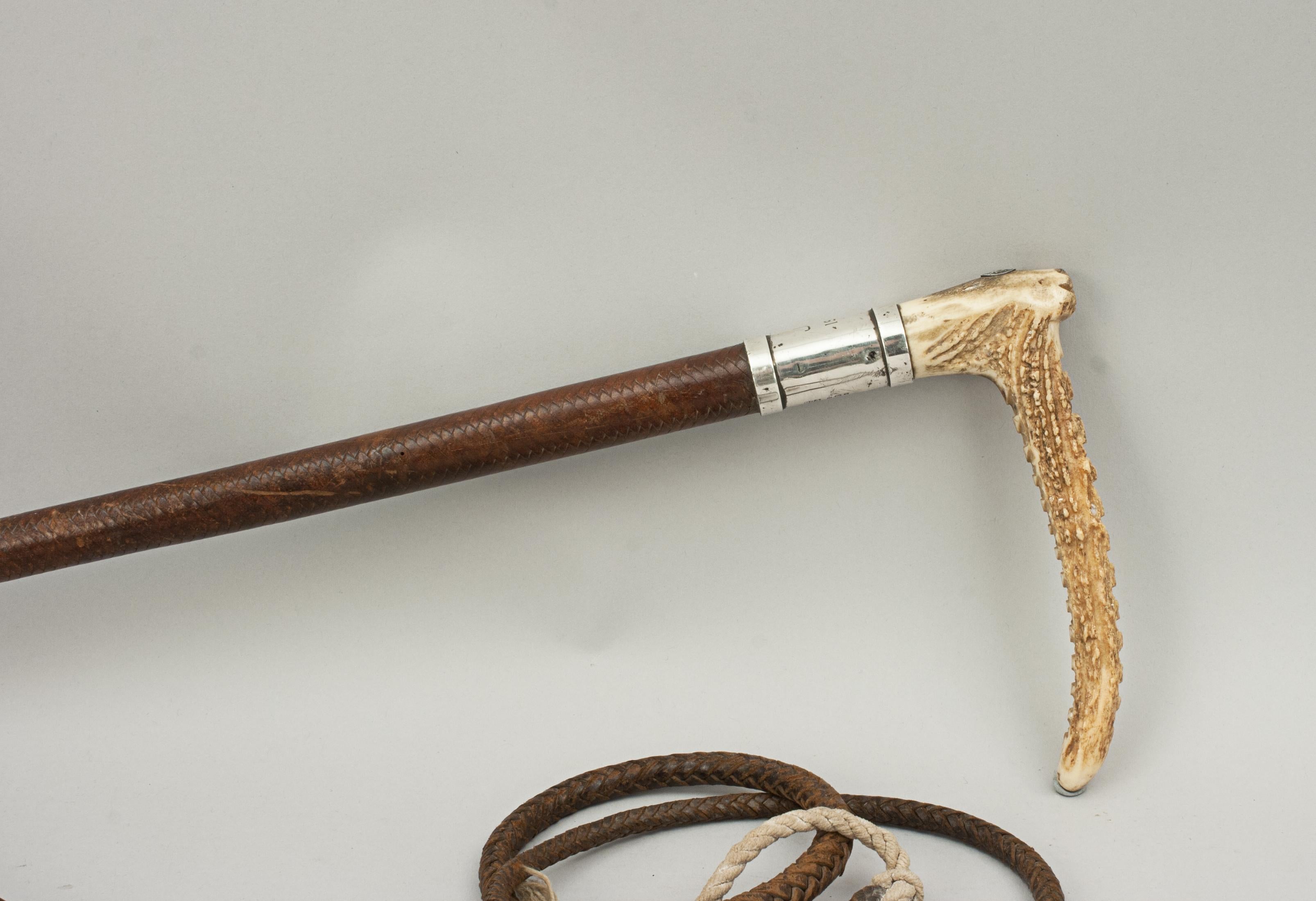 Vintage swaine hunting riding whip, riding crop, antler handle.
An old stag horn handled riding crop made by Swaine. The hunting crop shaft is covered with braided leather and has a silver collar marked 'SWAINE', hallmarked 'London, 1939', engraved