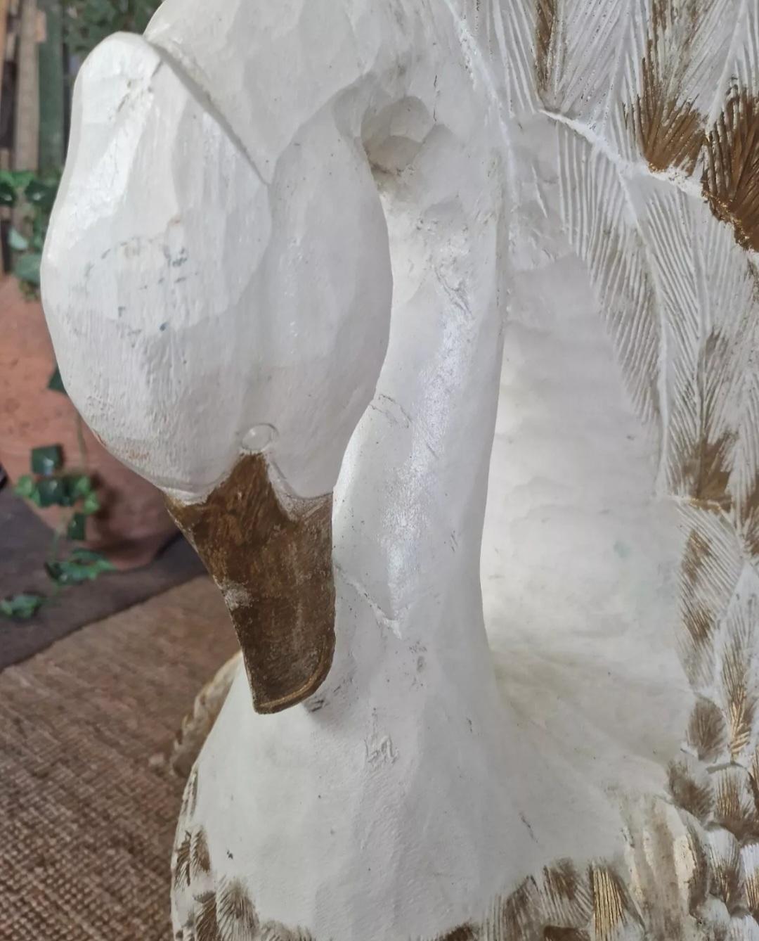 Add a Rustic Unique feel to your home or commercial space with this Beautiful Carved Swan Armchair, hand carved from a solid tree trunk. Crafted in the 20th century with intricate carvings and matt white lacquer with Gold details,  the detailing is