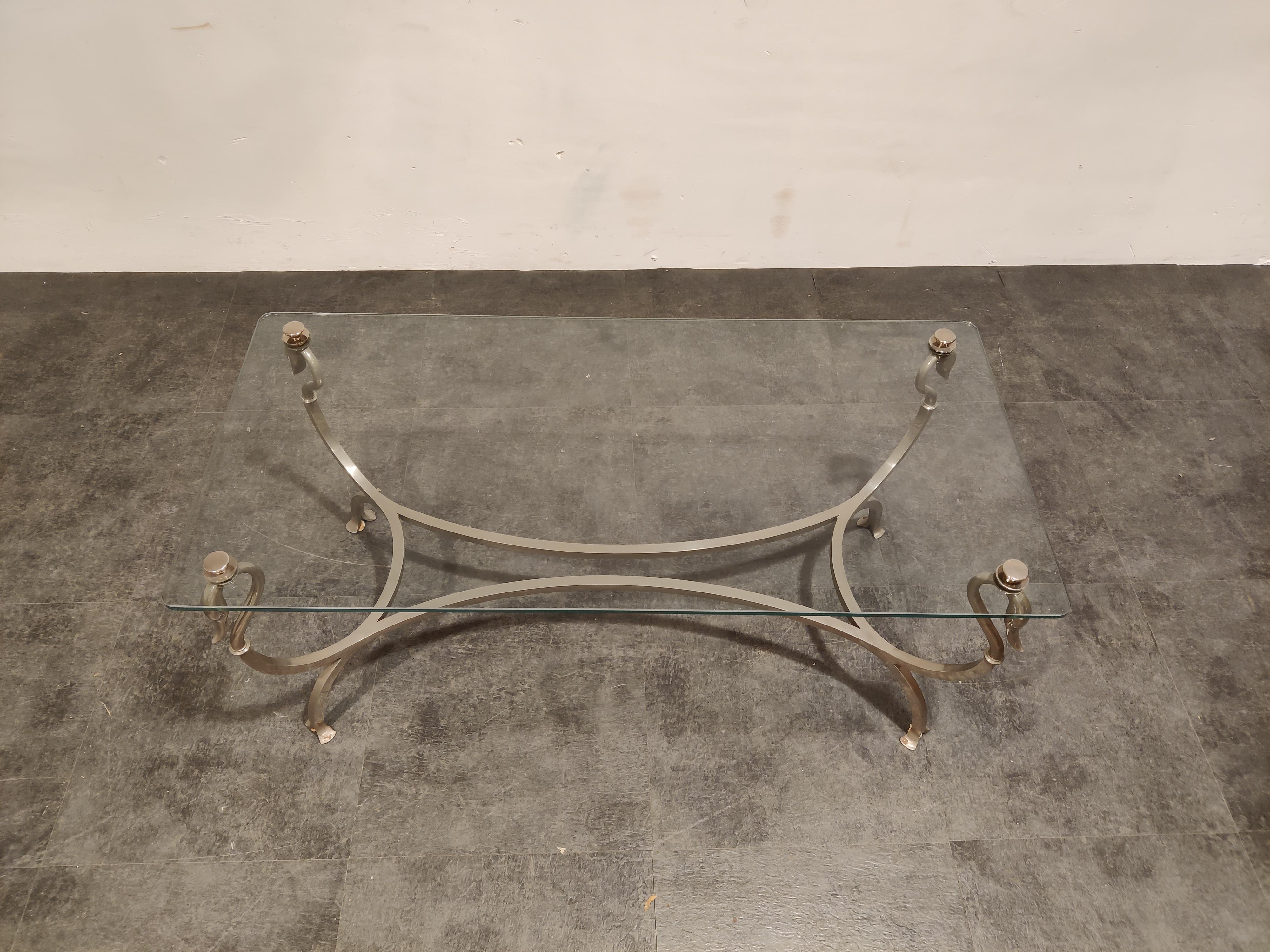 Elegant nickel and glass swan shaped coffee table. 

Beautiful decorative coffee table with a nice heavy quality frame.

In the style of Maison Jansen

1970s - France

Dimensions:
Height: 50cm/19.68