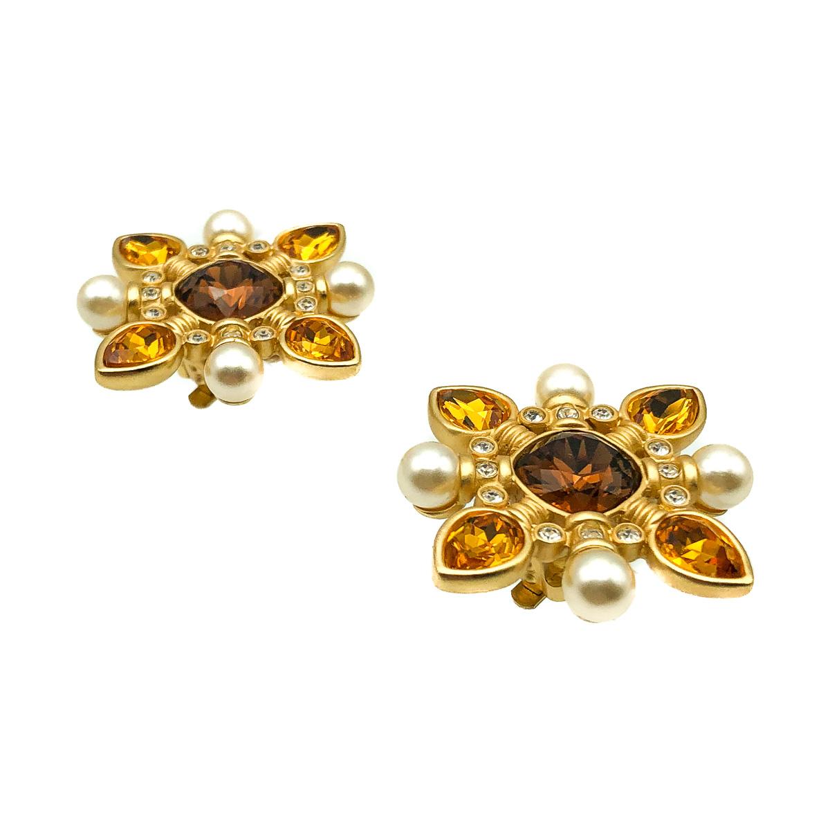 A pair of richly coloured Vintage Swarovski Cruciform Earrings dating to the 1980s. Featuring a cruciform style design centered around a large cushion shaped citrine crystal. Creamy whole pearls and tear drop citrine crystals form a delightful